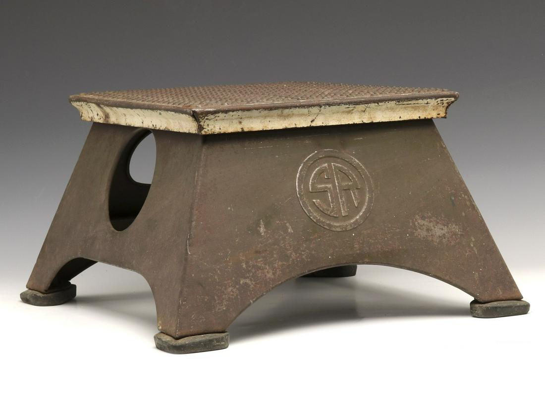 A SOUTHERN RAILWAY STEEL STEP BOX: The Southern Railway step stool with embossed lettering of 'SR' two sides, a hidden storage box in the base, signed with Morton Manufacturing Co. maker's plate. Measures approximately 11 x 20 x 18 inc