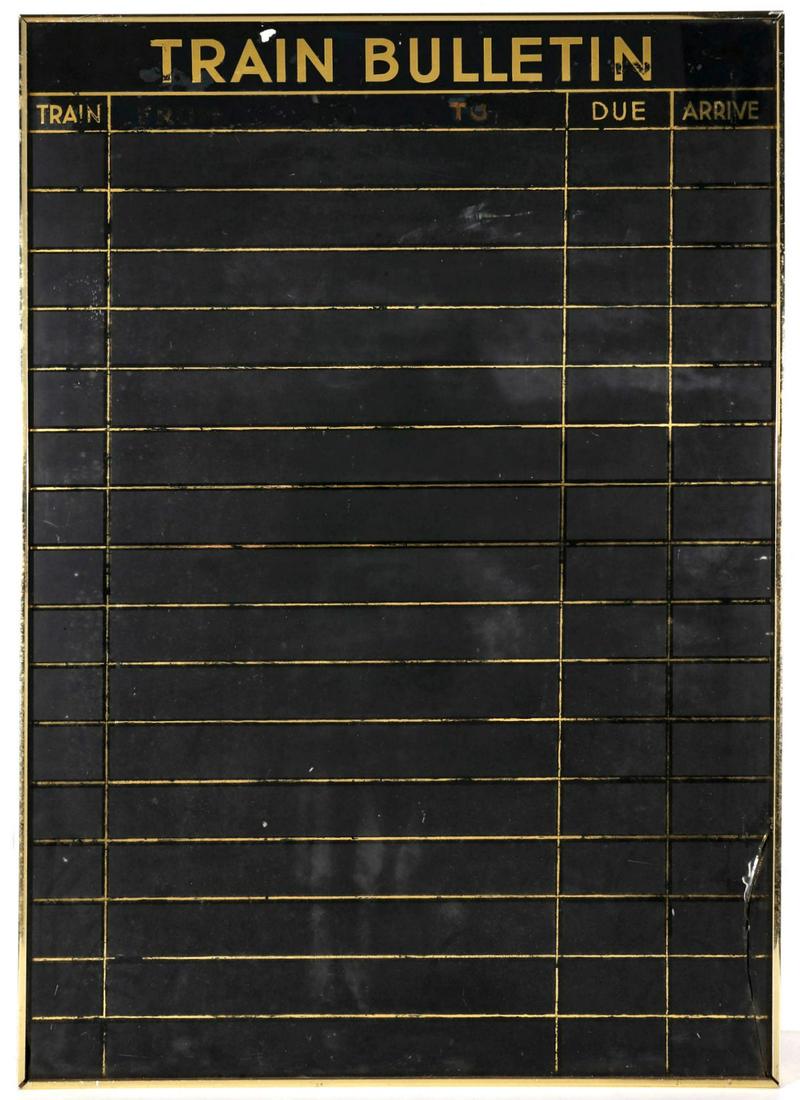A REVERSE PAINTED GLASS TRAIN BULLETIN SCHEDULING BOARD: The circa 1930s glass 'board' with break in a modern metal frame. Measures 42.25 x 30 inches. We happily provide seamless in-house packing and shipping services on nearly everything we sell.