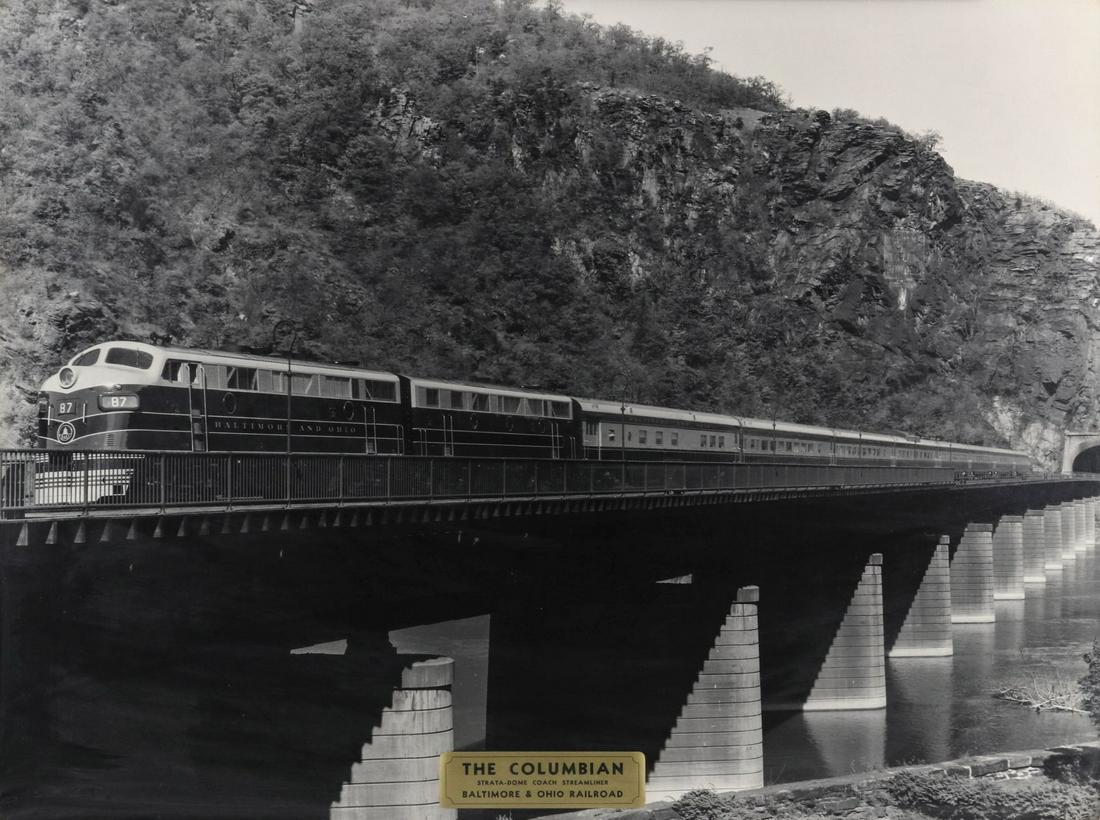 A B&O RAILROAD PHOTOMECHANICAL PRINT OF 'THE COLUMBIAN': The Baltimore and Ohio Railroad advertising print titled 'The Columbian, Strata-Dome Coach Streamliner' on the applied tag. We happily provide seamless in-house packing and shipping services on nearly