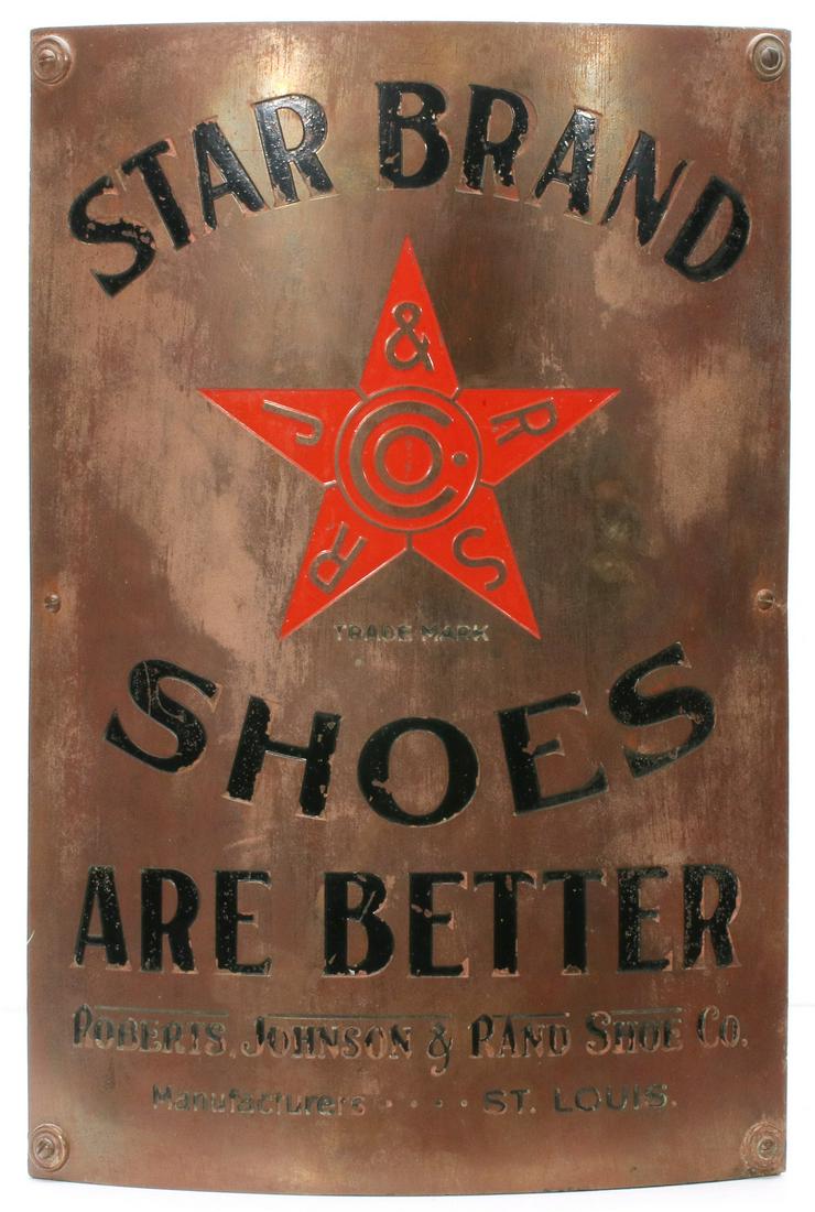 A STAR BRAND SHOES CUT BACK BRASS CORNER SIGN C. 1900: The incised lettering with red and black enamels STAR BRAND SHOES ARE BETTER with central red star trademark logo for Roberts, Johnson and Pano Co St. Louis. Measures 20 x 13.5 x 4 inches. We happily