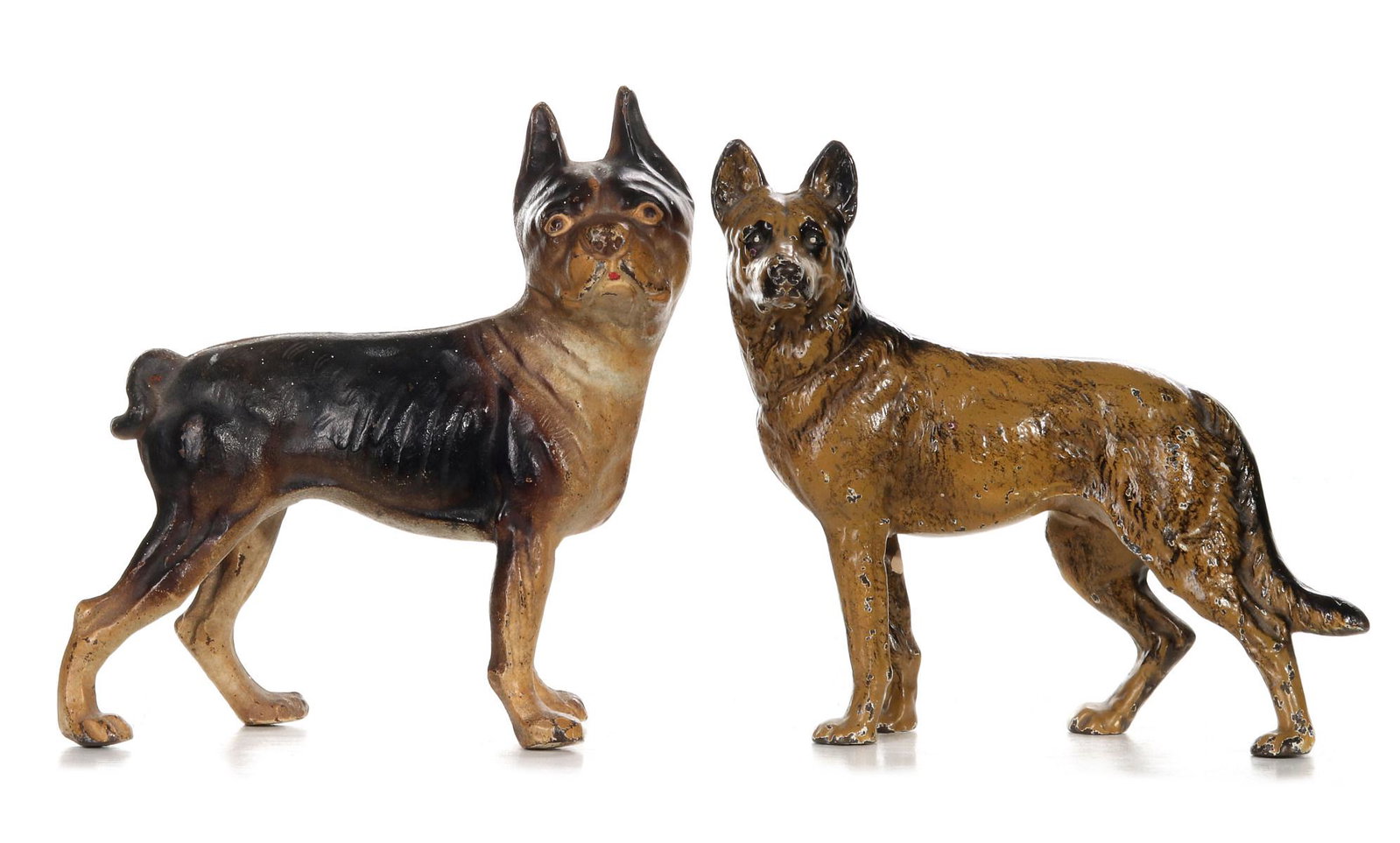 TWO HUBLEY CAST IRON DOG DOOR STOPS: Hubley Police Dog #290 and Boston Terrier Bulldog #331, polychrome doorstops, two piece construction with slotted screws, unsigned. Measures 9 x 10 x 4 and 9.75 x 9.5 x 3.75 inches. We happily provide