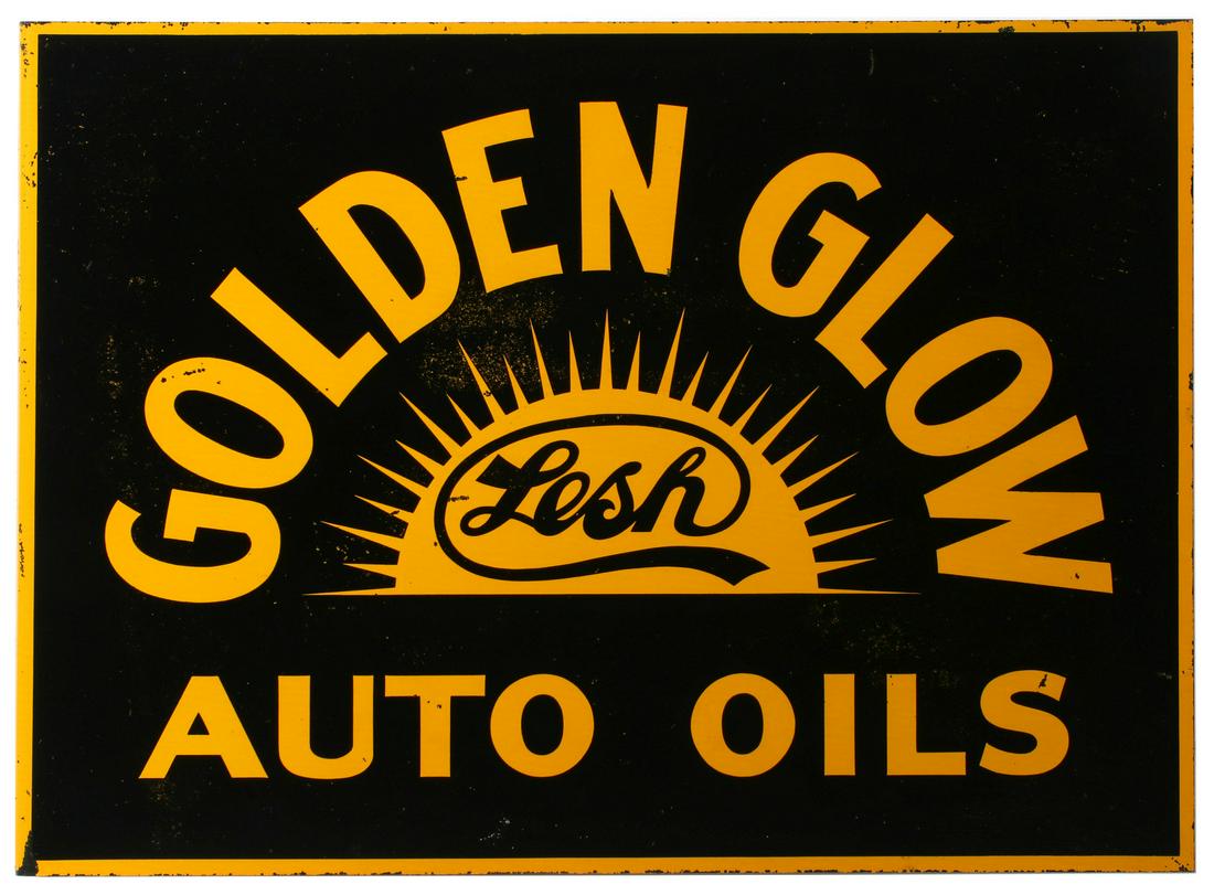A LESH GOLDEN GLOW AUTO OILS ADVERTISING FLANGE SIGN: The black and yellow flange sign with graphics for Lesh Golden Glow Auto Oils, signed American Art Works lower right. Measures 13.5 x 18.25 x 1.5 inches. We happily provide seamless in-house packing a