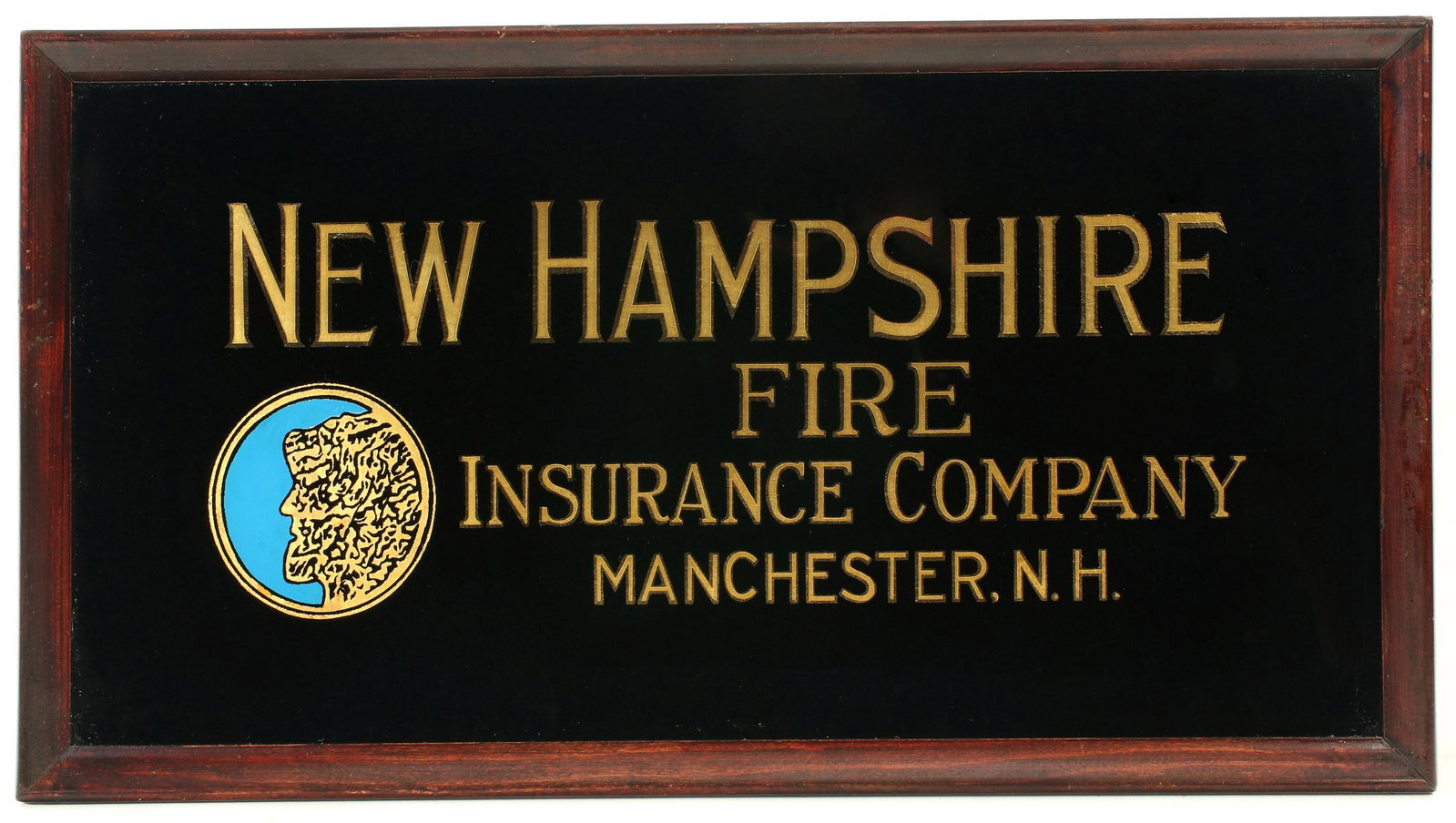 A NEW HAMPSHIRE FIRE INSURANCE CO REVERSE PAINTED SIGN: The black glass with etched and gilded letters along with a circular image of the rock formation known as The Old Man of the Mountain in the White Mountains. Measures 13.25 x 25.5 inches. We happily p