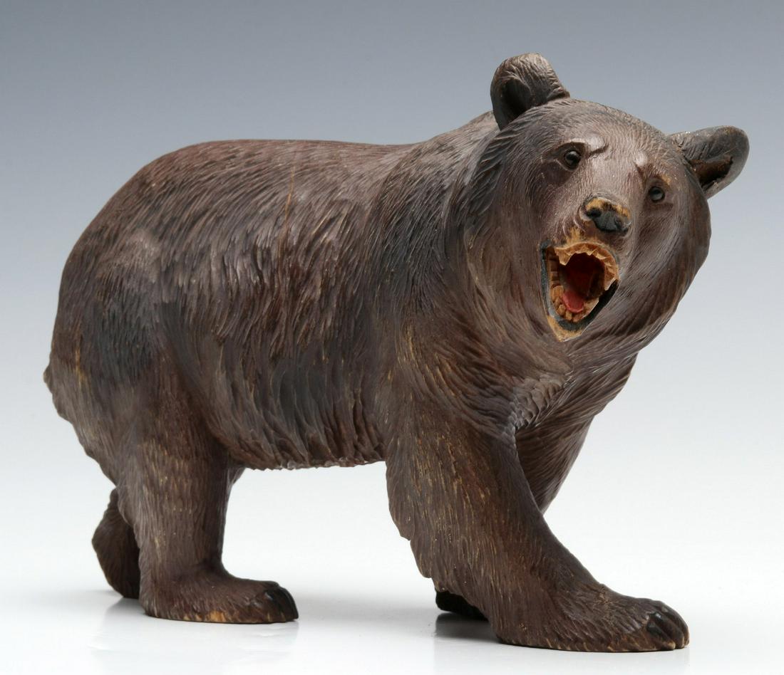 A GOOD SMALLER BLACK FOREST CARVED MODEL OF A BEAR: The carved figure of traditional Black Forest quality, tinting in the mouth, bead eyes. Measures 6.5 x 10.5 x 5 inches. We happily provide seamless in-house packing and shipping services on nearly eve