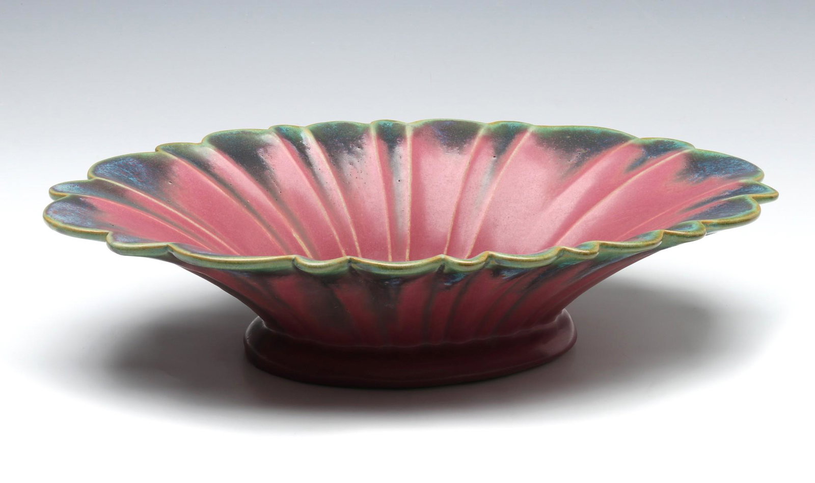 A THREE COLOR FULPER ART POTTERY CONSOLE BOWL: Low console bowl in pink and green matte glaze, Fulper vertical ink stamp on the underside of the base. Measures 3.25 x 16.25 x 10 inches. We happily provide seamless in-house packing and shipping ser