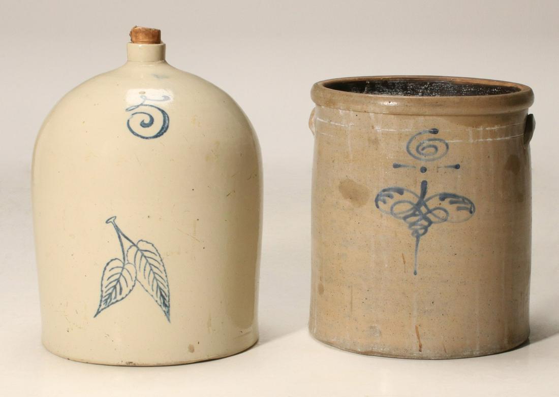 AN ESTATE LOT OF STONEWARE AND OTHER AMERICANA: The Red Wing 5 gallon birch leaf jug with crack, a Mid-western blue decorated crock with lug handle chip and base edge chips, German papier mache' horse with wood legs, wood platform, replacement whee