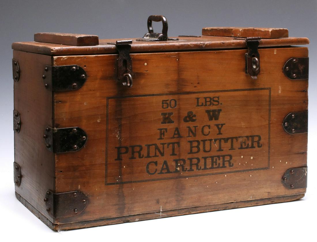 A COUNTRY STORE 'K & W FANCY PRINT BUTTER CARRIER' BOX: The wood box with hinged lid, iron hasps and hardware, pressed lettering reads '50 Lbs. K&W Fancy Print Butter Carrier.' Measures 13 x 21 x 12 inches. We happily provide seamless in-house packing and 