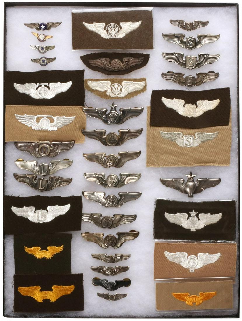 A VALUABLE COLLECTION OF 36 WWII AVIATOR'S WINGS: The assortment of aviator wings, including (left to right, top to bottom): air warning service; technical observer; liaison pilot; instructor; crew member; bullion; senior R crew member; service pilot