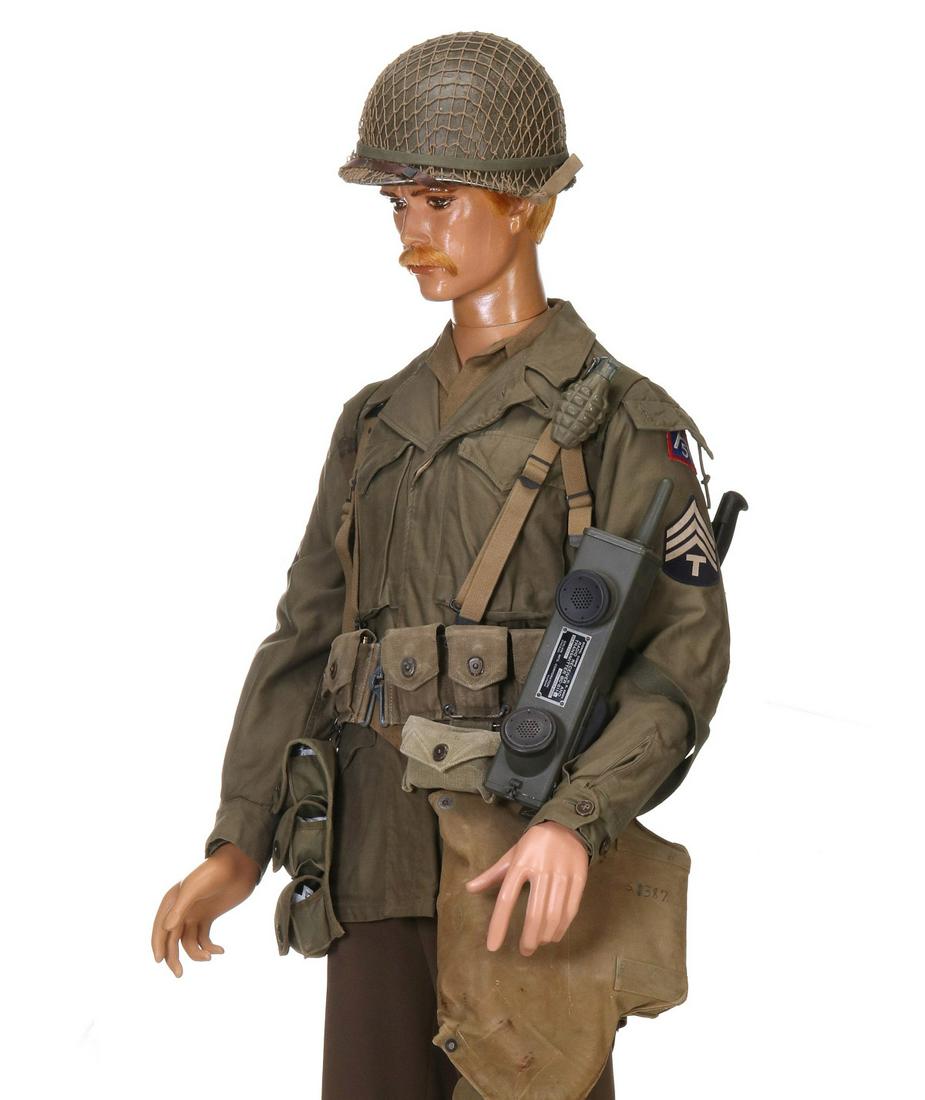 WWII INVASION SOLDIER DEPICTION FROM HELMET TO BOOTS: Invasion Depiction: Olive drab shirt and pants; double buckle boots; M-43 Field Jacket with T/Sgt stripes, SSI; rifle belt with harness and straps; First Aid pack with bandage; three pocket grenade po