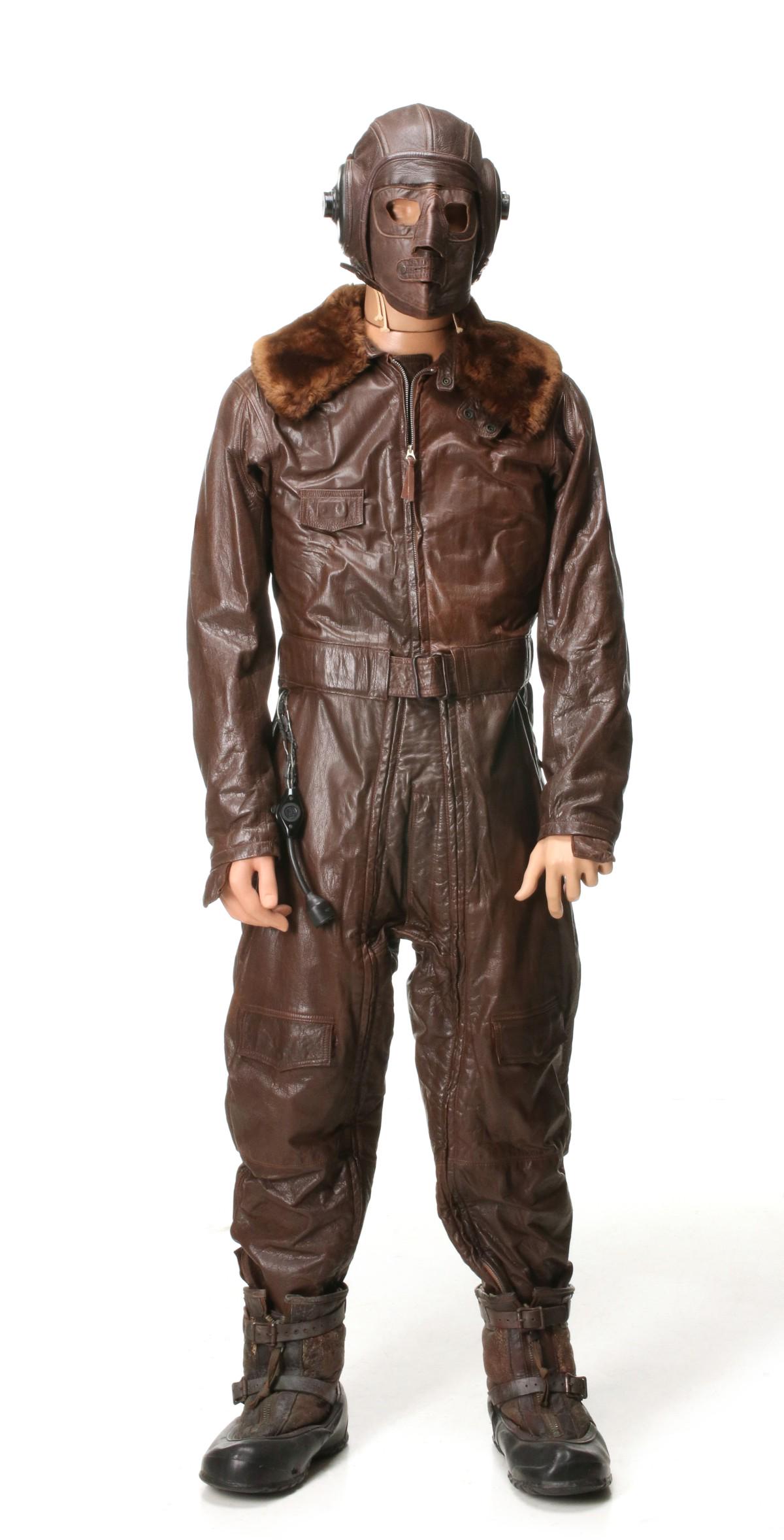 WWII HEATED NAVY FLYING SUIT, HELMET, BOOTS, GAUNTLETS: Navy one-piece electrically heated flying suit with leather gauntlets, B-6 flight boots N288s-21428 flight helmet with ANBH-1 earphones, stamped USN, and leather face mask. All veteran attributions an