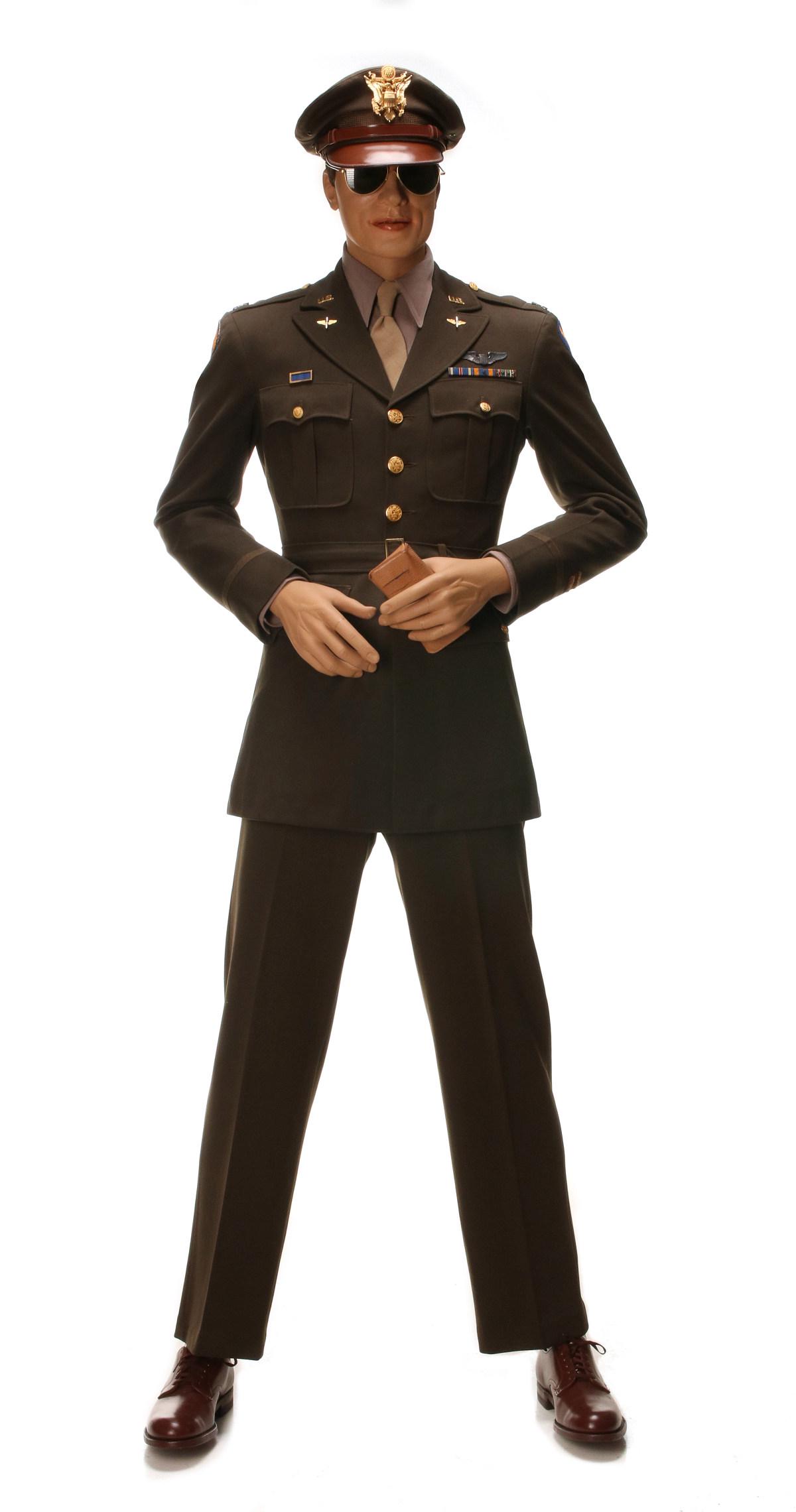 CAPT. SWANNER UNIFORM, BULLION, AIR MEDAL, MUCH MORE: Uniform consisting of tunic with 8th AAF SSI on left shoulder, three ribbon bars, two bullion overseas bars, pilot wings, PUC, shirt, tie, pants, shoes, visor crusher cap; Crew photo; Cased Air Medal;