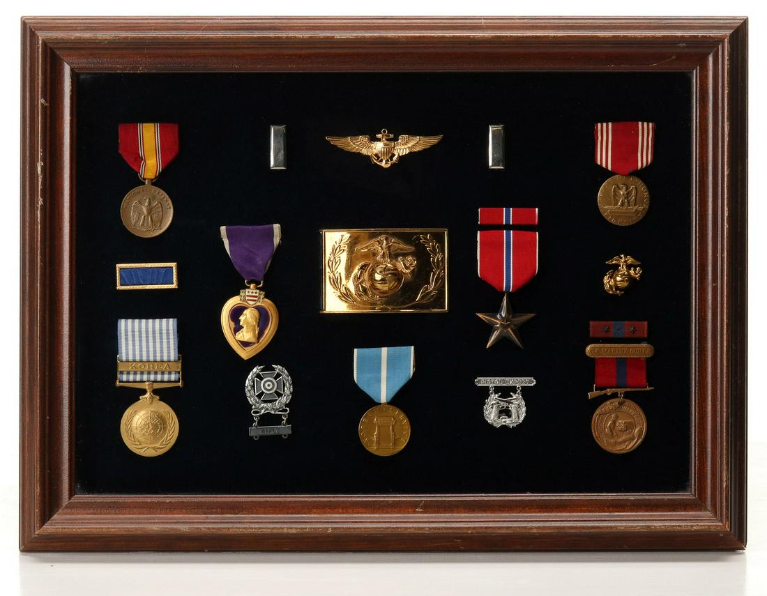 PURPLE HEART, BRONZE STAR, OTHERS FROM VET OF TWO WARS: Unidentified Two Service Vet Frame; USMC Sgt. Belt Buckle; USMC Pilot wings; Pair 1st Lt. rank insignia ; USMC EGA in gold; USMC Good Conduct medal with ribbon bar with two stars; USMC Pistol Expert b