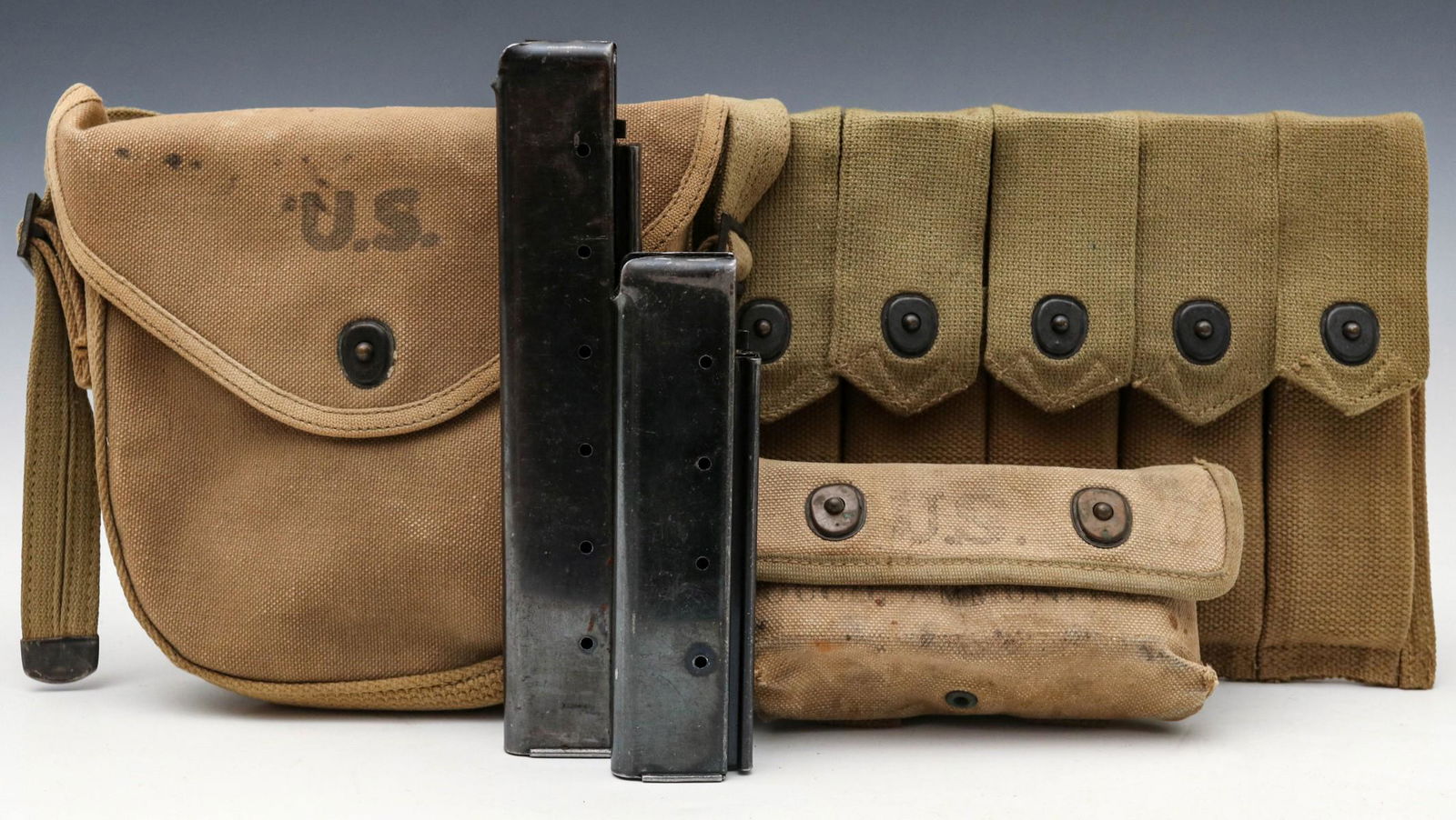 THOMPSON DRUM MAG POUCH AND OTHER WEB GEAR: Thompson drum magazine pouch only; SMG magazine pouch for USMC Reising SMG with .5 caliber 20-round magazines; Thompson SMG 30-round magazine; Thompson SMG 20-round magazine; machine-gun lube oil tin.