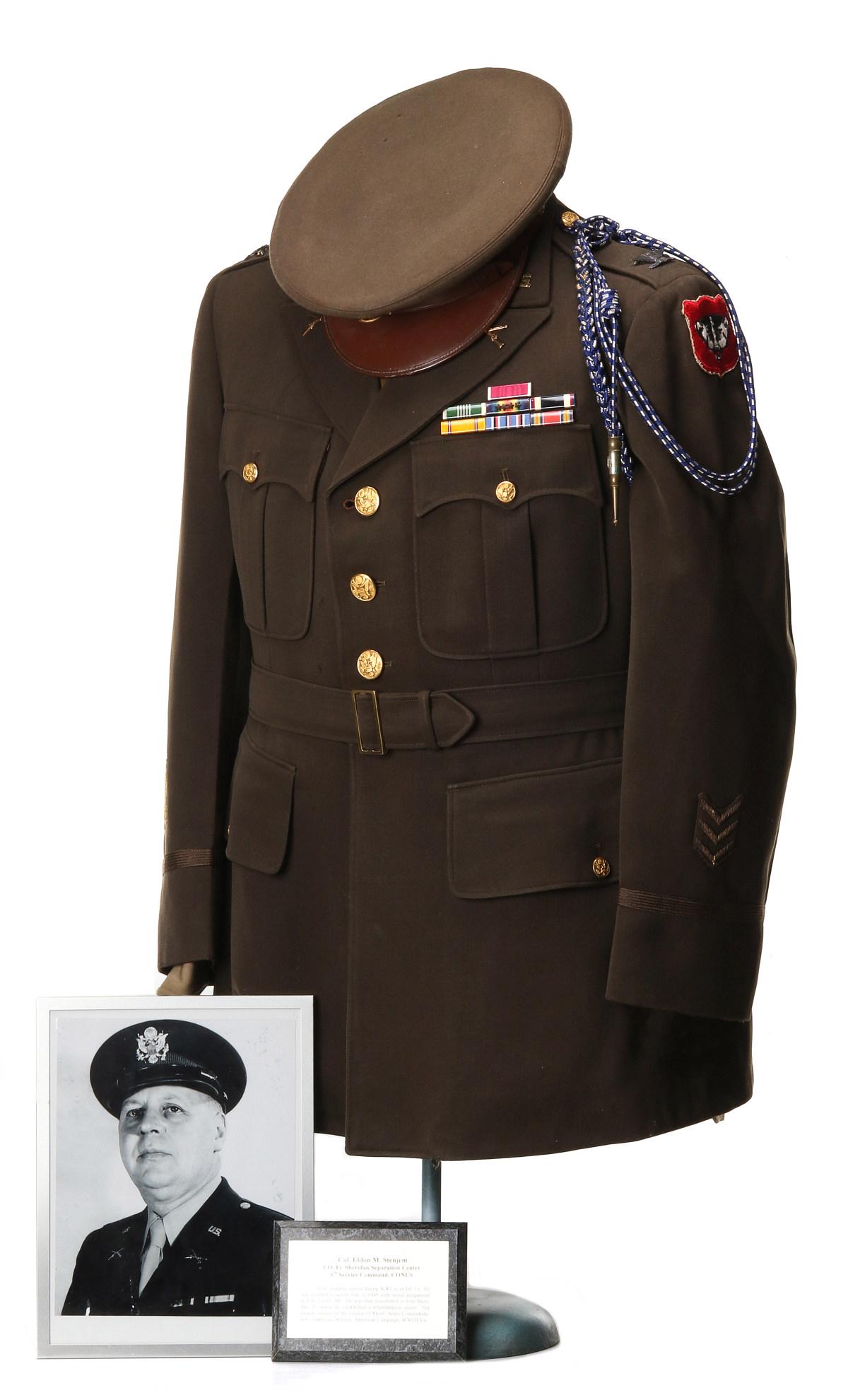 COL STENJEM, TWO WAR VET, LEGION OF MERIT, COMMENDATION: Colonel Eldon M. Stenjem, Infantry. Service uniform consisting of: Tunic with Wisconsin National Guard SSI and shoulder cord; Seven ribbons; MVC, Three WWI sleeve stripes; shirt; tie; pants; visor cap