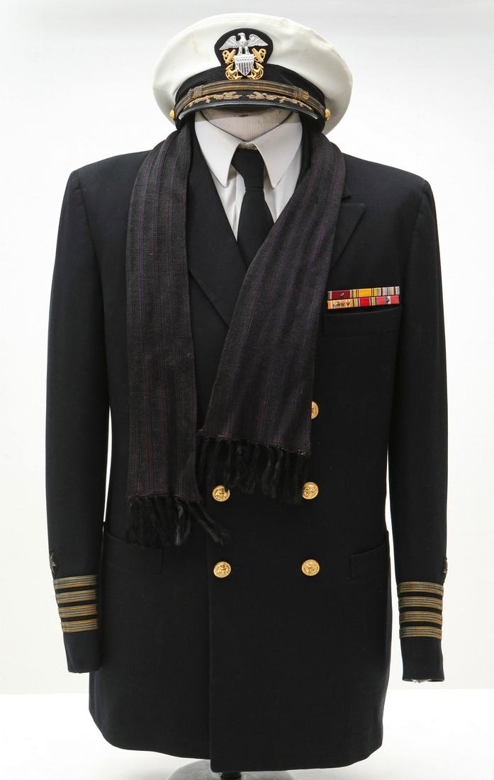 UNIFORM OF CPT MOSE 'MIKE' GROSS, PEARL HARBOR SURVIVOR: Captain Mose Gross, USNR, Pacific Theatre. Pearl Harbor survivor 'Mike' Gross was commissioned as an Ensign on 12 Dec 1940. He was assigned to light cruiser USS Helena as Assistant Navigator. When the
