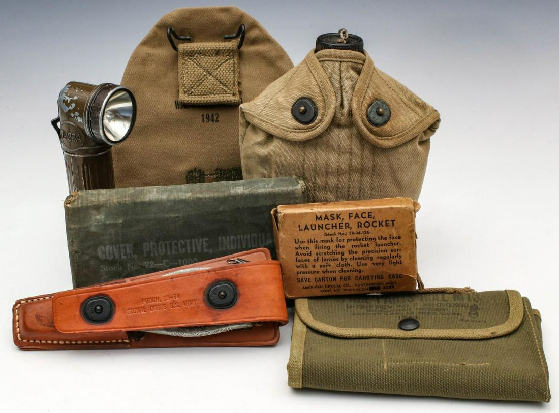 A COLLECTION OF US WWII FIELD GEAR: Field gear includes: Entrenching tool cover dated 1942. Protective cover (chemical). Pouch CS-34 with pliers and TL knife. Spare parts roll M13 dated 1944. Canteen with cup and cover dated 1943. TL-12