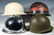 A COLLECTION OF US WWII AND OTHER HELMETS - 3