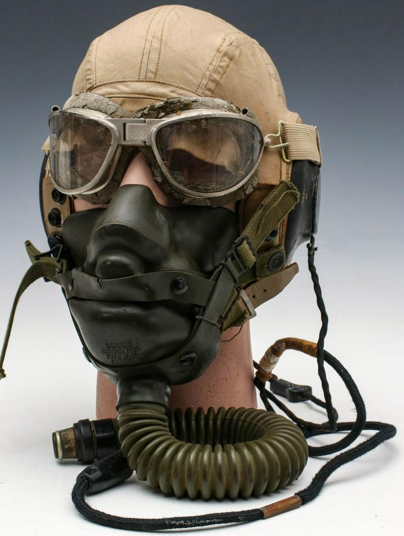 AN-H-15 WWII FLIGHT HELMET EARPHONES, MASK, GOGGLES: The USAAF AN-H-15 helmet with ANB-H-1 earphones, A-14 oxygen mask and B-7 goggles. Measures 11 inches not including the air hose. Good condition noting brittleness to some of the rubber items. All vet