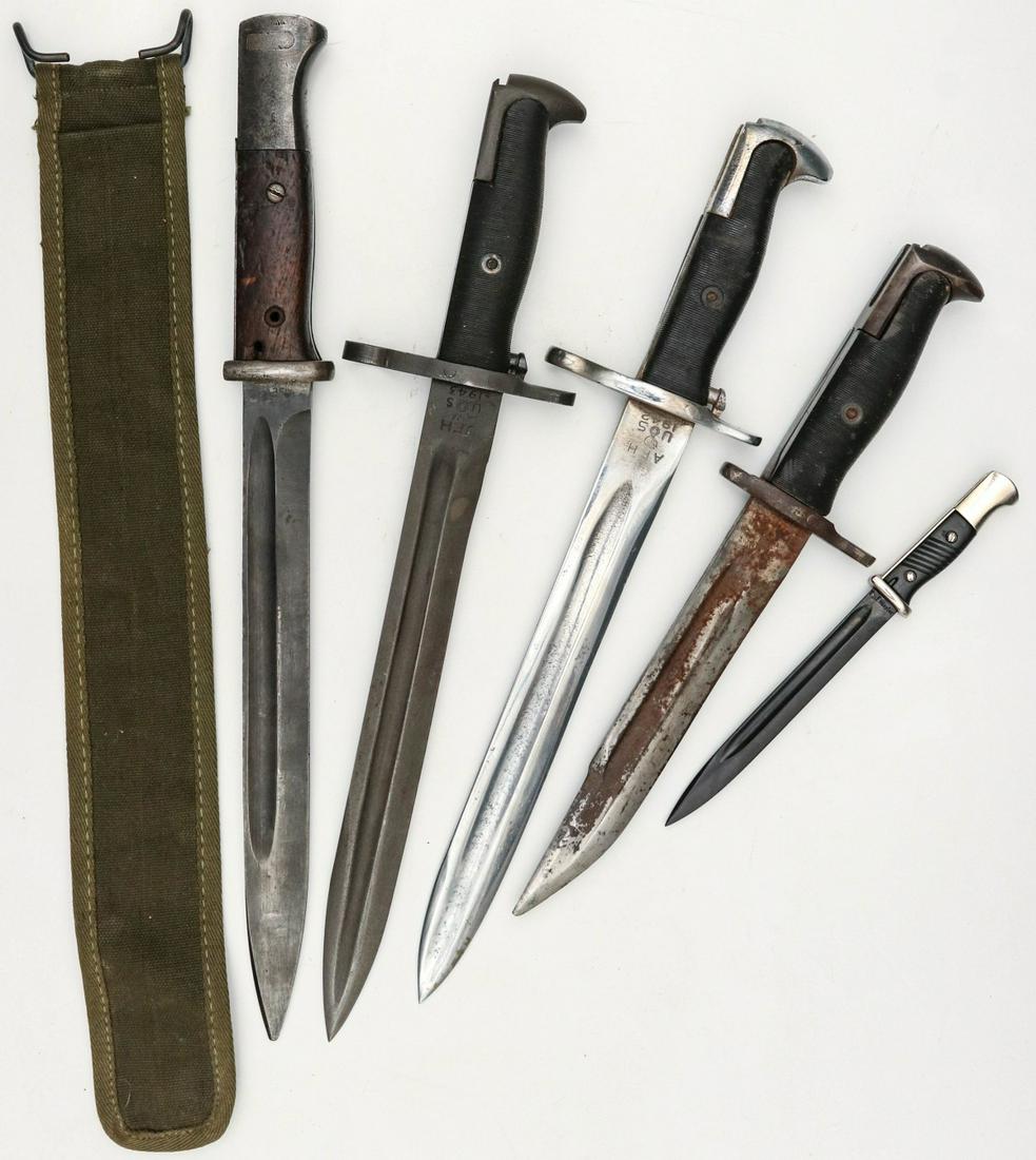 A COLLECTION OF GERMAN AND AMERICAN BAYONETS: Collection of military weapons and accessories including: canvas scabbard for M-1942 bayonet;1943 bayonet (cut down); M-1942 (cut down into fighting knife); M-1942 (cut down and chromed for parade); G