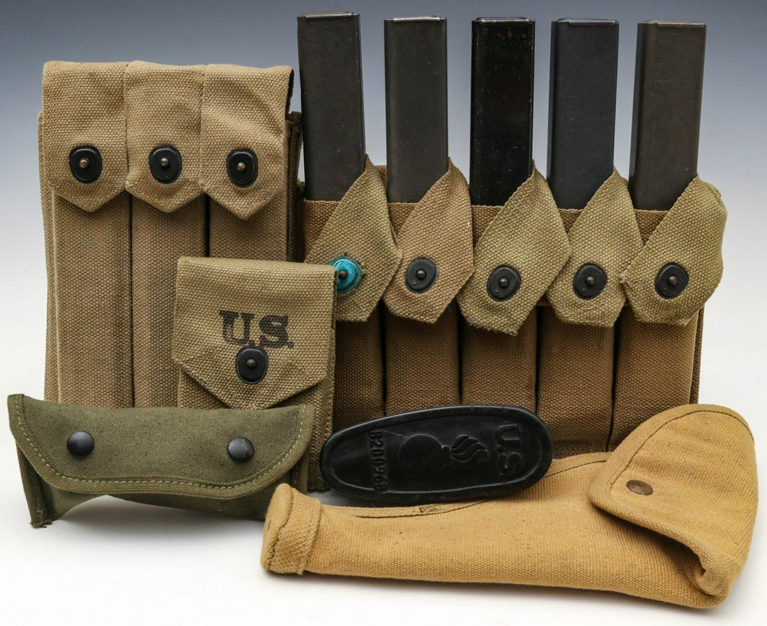 US WWII MAGAZINE POUCHES, HOLSTER AND OTHER WEB GEAR: USMC SMG magazine pouch with three 30-round magazines; SMG magazine pouch with five M-3 magazines; two .45 caliber magazine pouches with two magazines each; two grenade launcher sights; M-1 and Spring