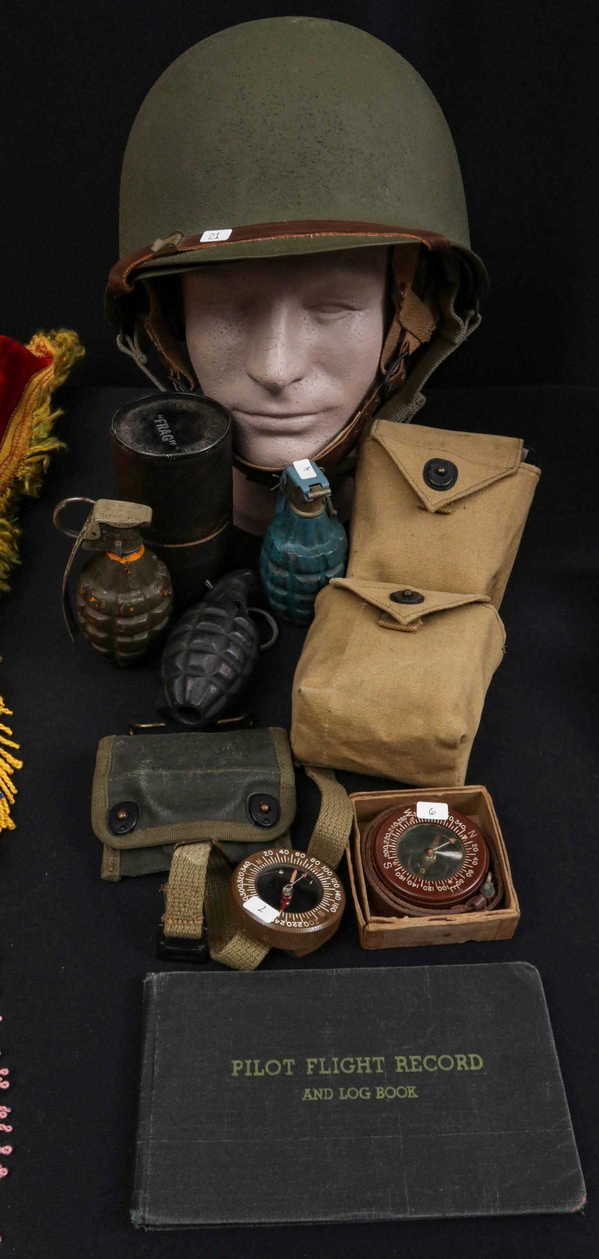 AIRBORNE RELATED ITEMS, FLIGHT LOG, TRAINING GRENADES: The entire lot as shown, M2 parachute helmet (age and origin not confirmed or guaranteed, does not appear to be period), wrist compasses, frag grenade in canister, etc. The foam head is not included. 