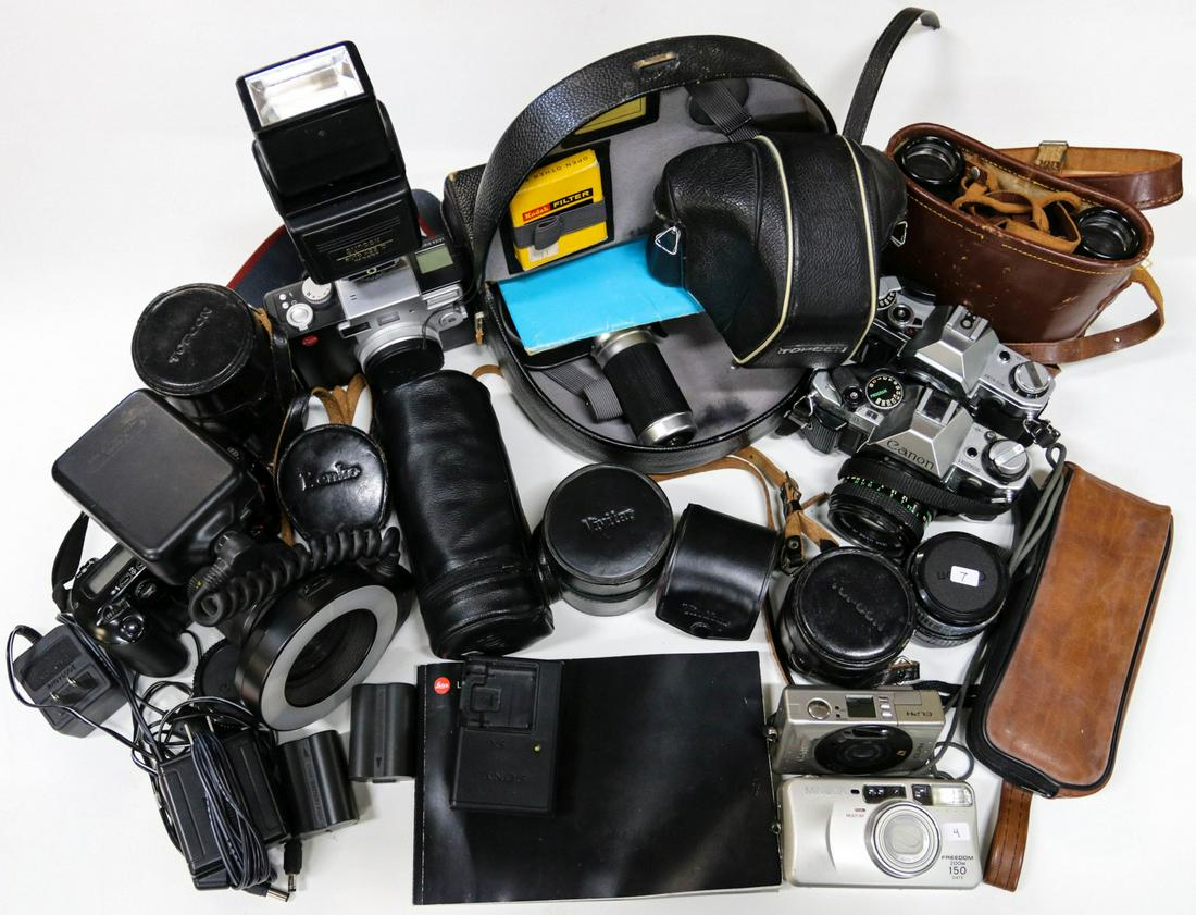 LARGE LOT OF CAMERAS, LENSES, ACCESSORIES, BINOCULARS: Zoomex Model II motion camera with case accessories and booklet belonged to Staff Sergeant Clarence Peaslee. 8X 30 binoculars with neck strap, case, shoulder strap, soldier bring back. Canon Rebel X E