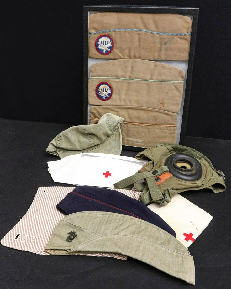 HEADGEAR INCL AIRBORNE GARRISON CAPS, FLIGHT HELMET: Post war flight helmet and more as shown. All veteran attributions and histories have been provided by the consignor and are believed to be accurate but not guaranteed by the auctioneer. Provenance: T
