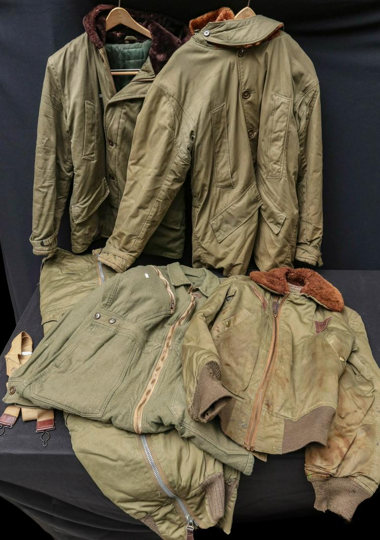 US WWII AAF B-11 AND B-15 FLIGHT JACKETS, ETC: Aviator's cold weather gear to include B-11 jackets, modified; B-15 jacket; A-11 trousers with suspenders; and gabardine flight suit L-1. All veteran attributions and histories have been provided by t