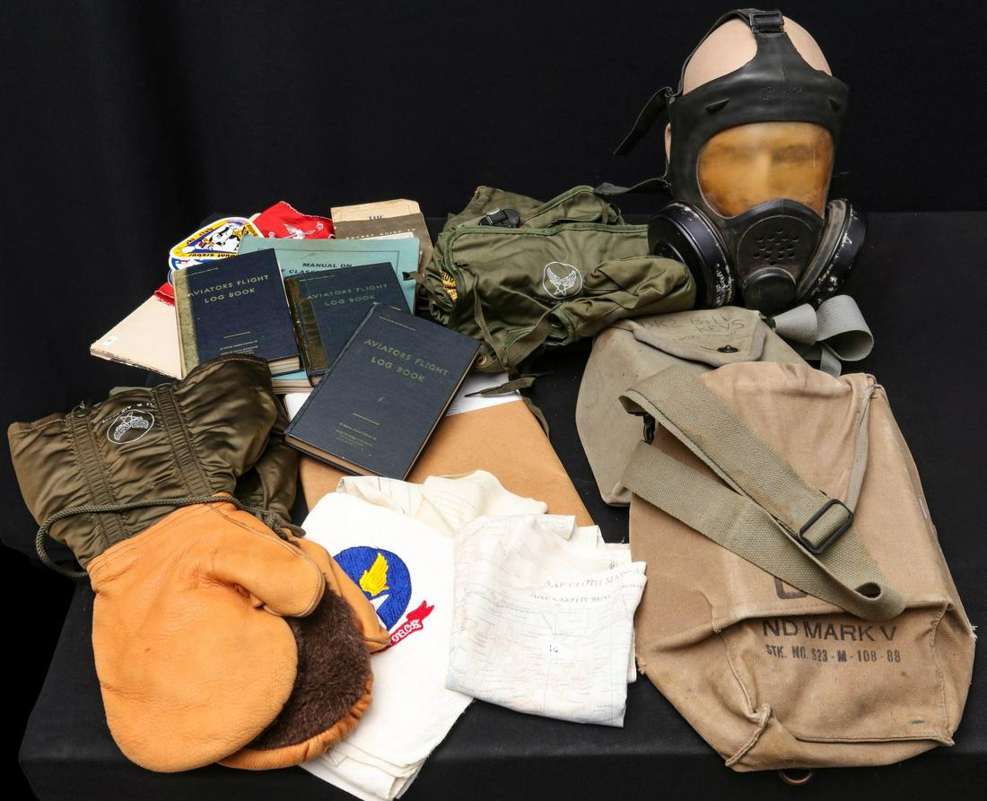 BOMBER CREW GLOVES, SILK MAPS, MASK, GEAR, NAMED LOGS: Manual on AAF Classification and Assignment, 1945; three flight logs belonging to Lieutenant Commander T.R. Leggett; two pair AAF electronic flying inserts; blue AAF handkerchief; red AAF handkerchief