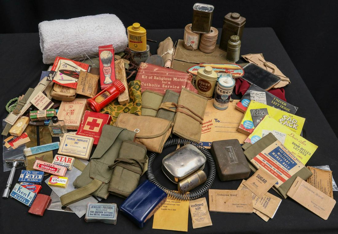 A LARGE COLLECTION OF WWII SOLDIER PERSONAL EFFECTS: Assorted personal items to include: towel; shaving brush with holder; shaving brush with original box, metal U.S. Army soap tin with original soap; metal soap tin with original soap; plastic soap box,