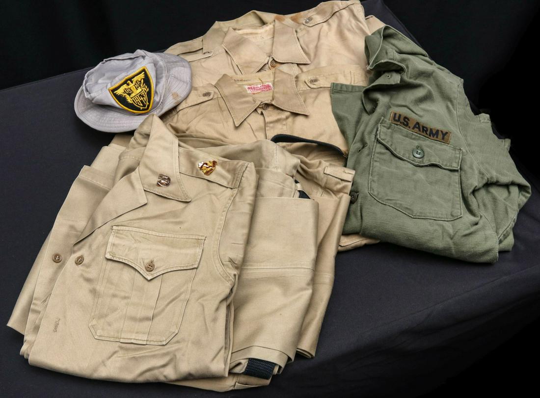 ASSORTED SUMMER GARRISON CAPS AND NAMED UNIFORM PIECES: CWO St. John includes - Summer short sleeve khaki unit with all insignia, unit long sleeve without insignia, two unit with SSI; Private Scott - Fatigue jacket with insignia; Assorted summer garrison c