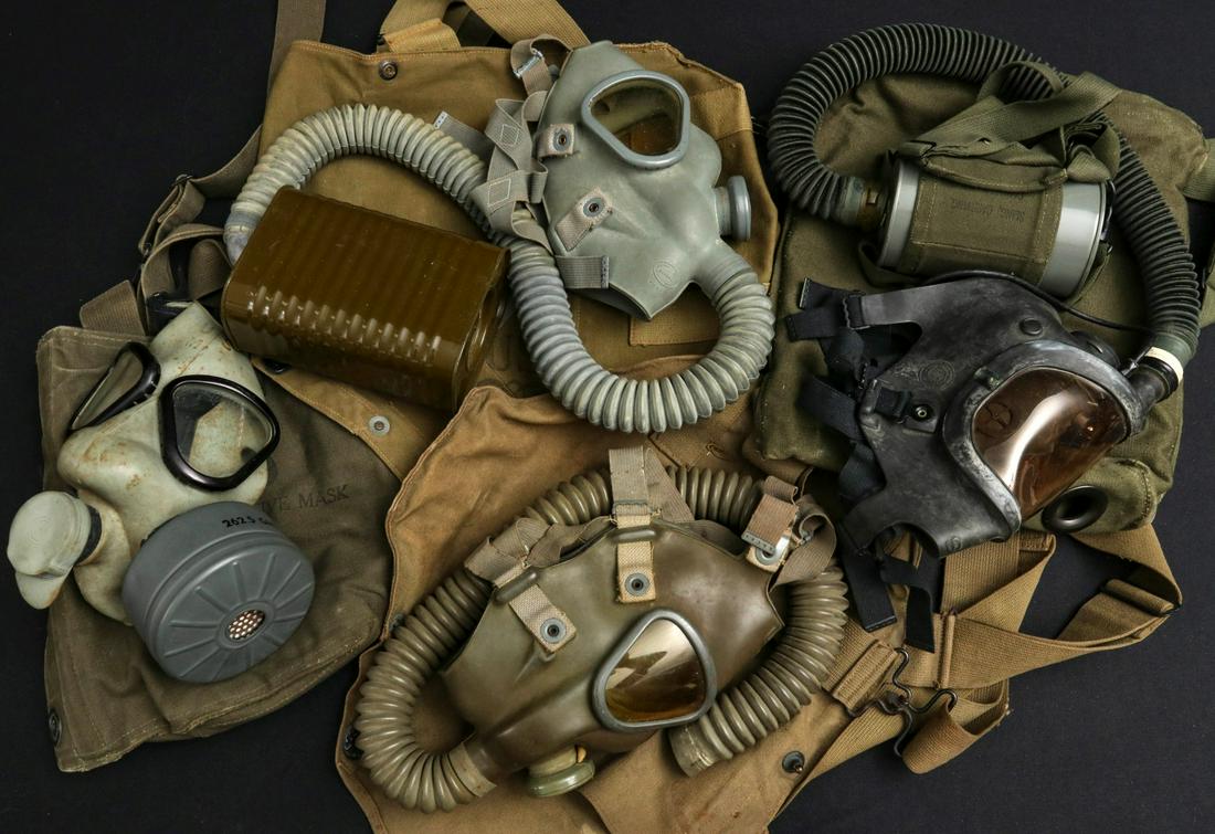 A COLLECTION OF VARIOUS US WWII GAS MASKS: Assorted Gas Masks: MIIIA1; MIVA1; M5-11-7 assault; Carry pack for Optical gas mask M1; Optical gas mask M1; Carry pack, Army lightweight gas mask; Army lightweight Optical mask, un-issued; Protective