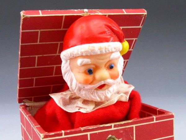 VINTAGE SANTA JACK-IN-BOX POP UP TOY: Measurements of 4 x 3.5 inches. Wood box paper litho brick chimney with Santa's head popping out. Head made of Plastic, Japan on bottom.
