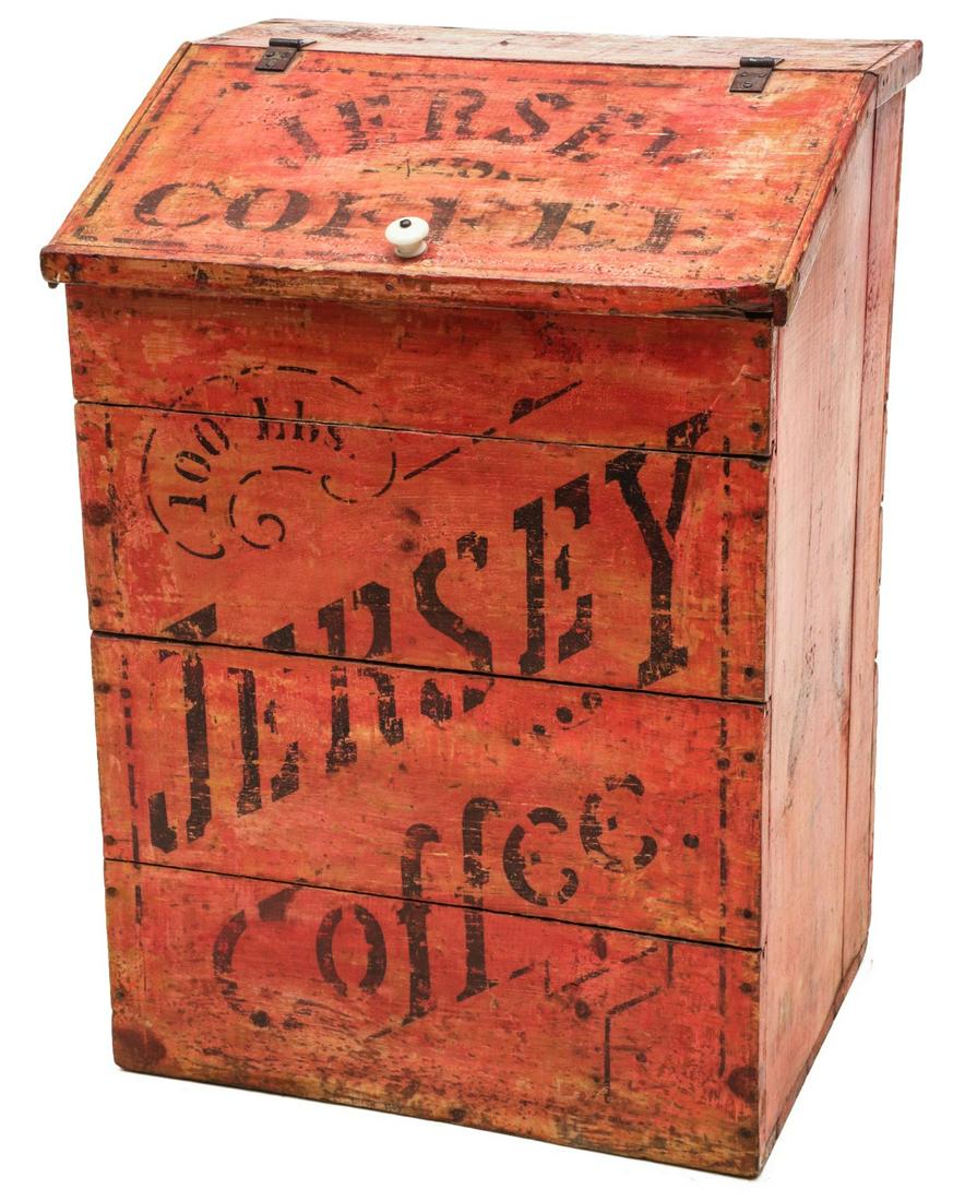 A PAINTED SLANT TOP JERSEY COFFEE ADVERTISING STORE BIN: The original light red stain with black stenciled lettering and graphics on soft wood case. Measures 31.5 x 22.5 x 17 inches. Provenance: The Jerry and Cathy Mueller Collection, Sioux City, Iowa We ha
