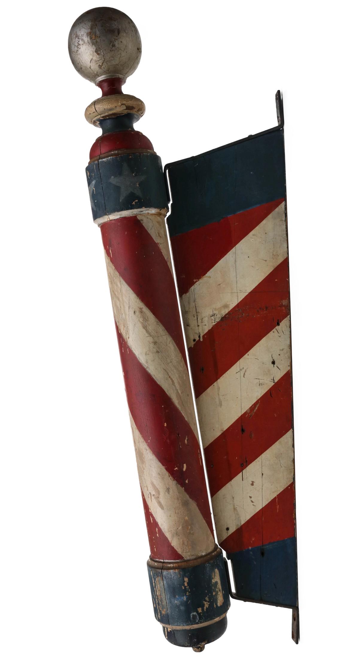 AN EXCEPTIONAL WALL MOUNT BARBER POLE WITH STARS: The outstanding turned wood Barber Pole retaining the vast majority of its red, white, blue, gold and silver paint with stars, turned wood with pronounced ball form finial over large bulbous elements,