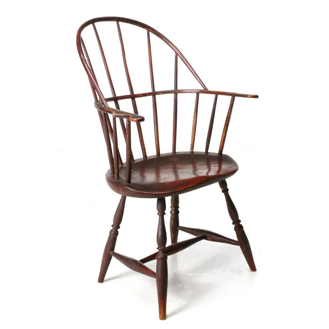 AN 18TH C. SACK BACK WINDSOR CHAIR WITH ORIGINAL PAINT: The bentwood ash back on mid-rail with scroll-cut arms, oval carved pine saddle seat, turned legs; original paint with somewhat dry and crusty surface. Measures 37.5 x 24.25 x 22 inches with a seat he