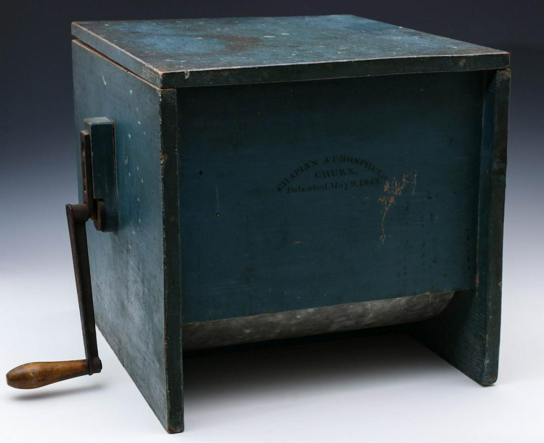 A RARE 'CHAPIN'S ATMOSPHERIC CHURN' IN ORIGINAL PAINT: Nathan Chapin of Cortlandville, New York was awarded a patent for his Atmospheric Churn in 1848, a twist on the box rotary churn, this exceptional example with black stenciling on the original blue pa