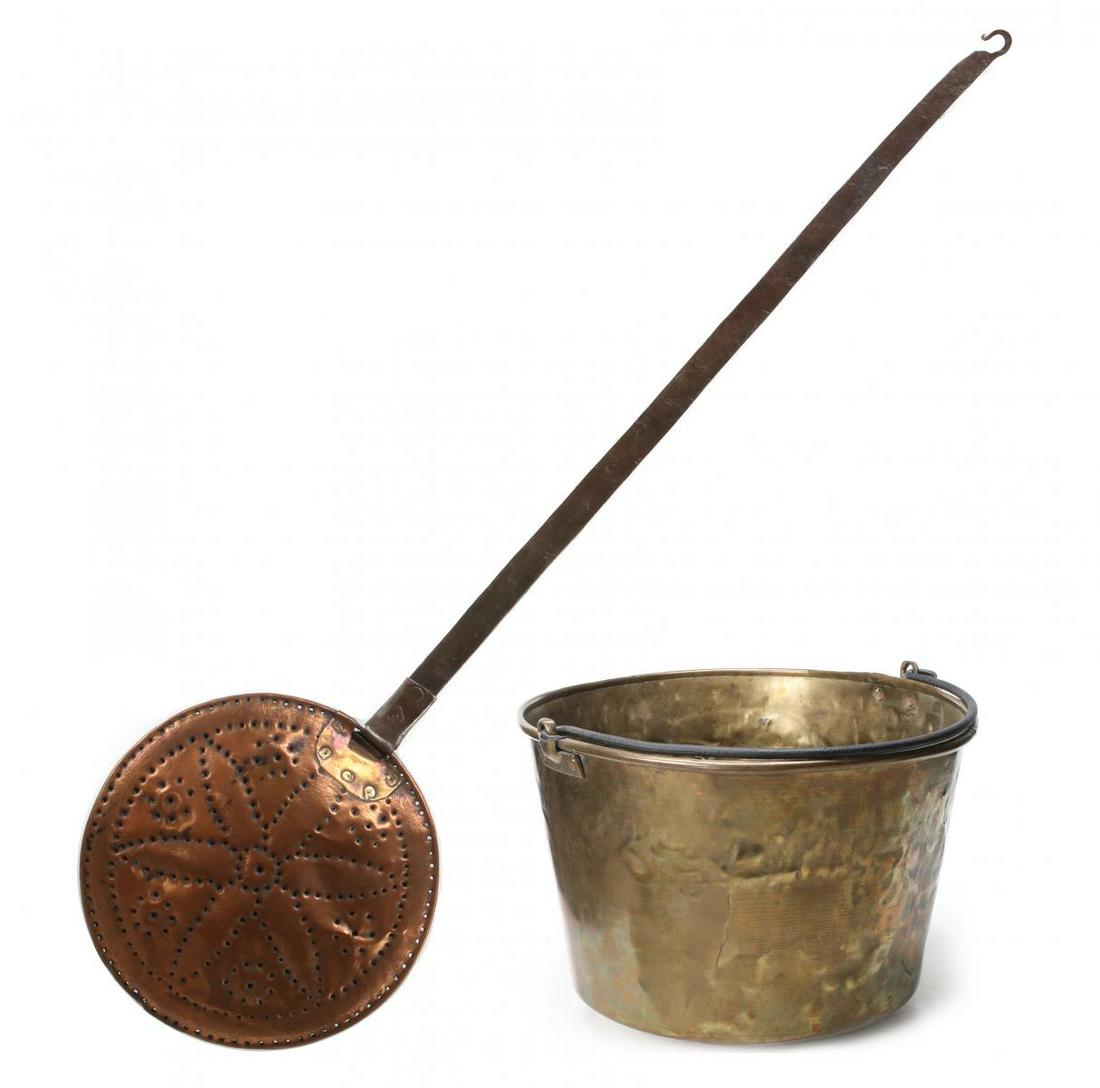 AN EARLY COPPER BED WARMER AND SPUN BRASS BUCKET: The early copper bed warmer with forged iron handle and rivets, pierced pin wheel pattern on the hinged lid; plus a spun brass pail with iron bail handle, signed H.W. Hayden patent date 1851. The bed 