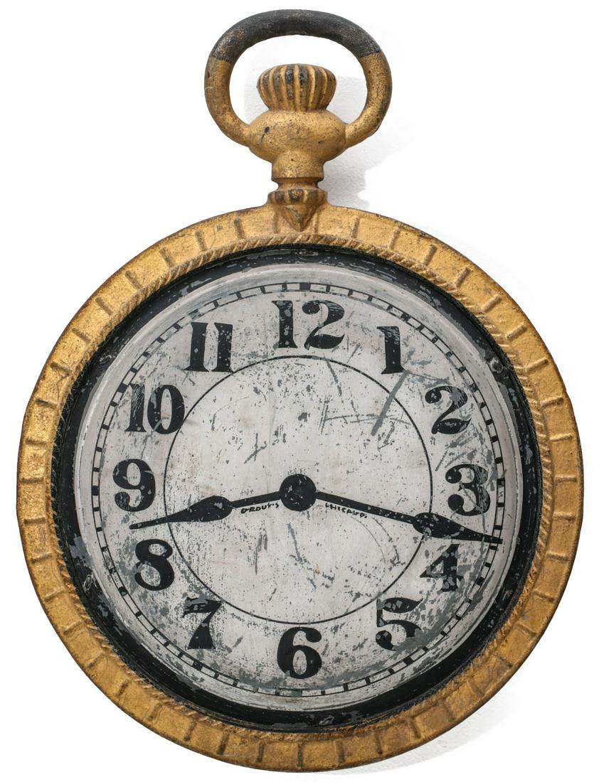 A CAST IRON AND ZINC WATCHMAKER'S TRADE SIGN C. 1900: The over-sized model of an iron pocket watch with coined edge, hand painted zinc dials having Arabic numeral chapter ring and hands depicted in black enamels on white ground, the top half of the bail 