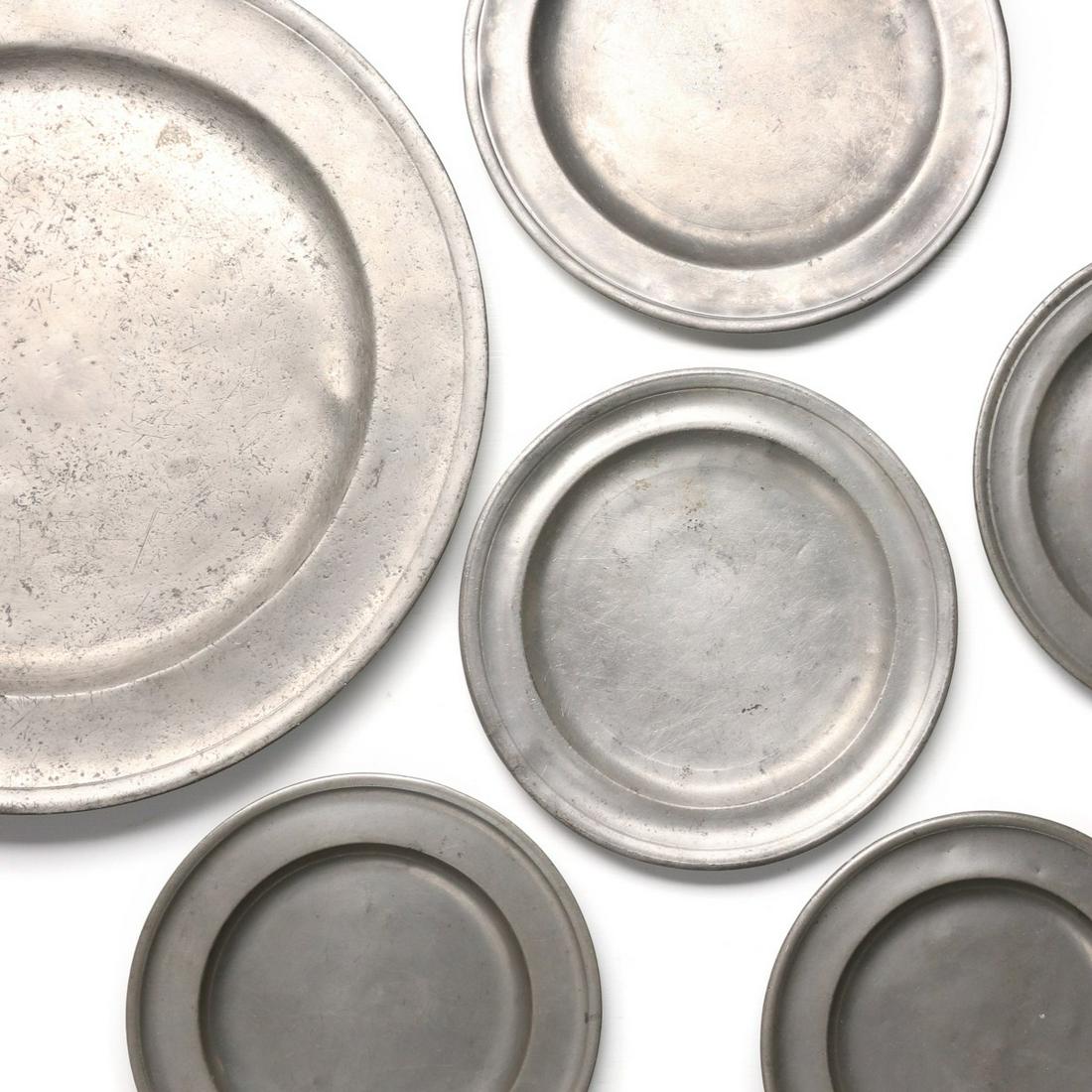 A COLLECTION OF 19TH CENTURY CONTINENTAL PEWTER: The collection of pewter chargers and plates as shown. Sizes range from0.5 x 7 to 1 x 13.5 inches. Provenance: The Jerry and Cathy Mueller Collection, Sioux City, Iowa We happily provide seamless in-h
