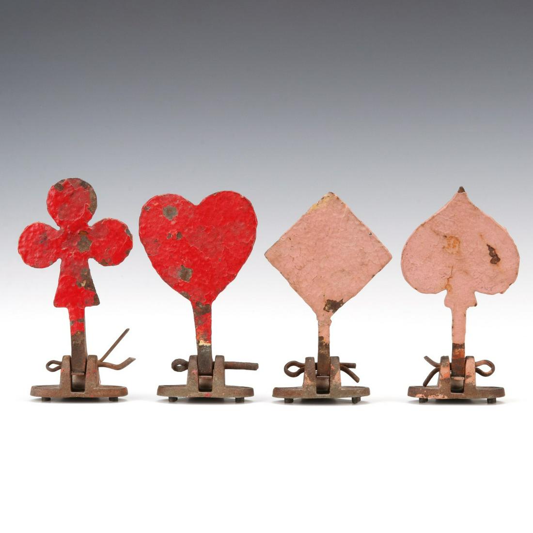 A SET OF MANGELS PLAYING CARD SUIT FIGURAL IRON TARGETS: The nice colorful set of the four playing card suit symbols in cast iron on base with cotter key pivot, a popular theme but not commonly found, particularly in old paint. Attributed to William F. Mang