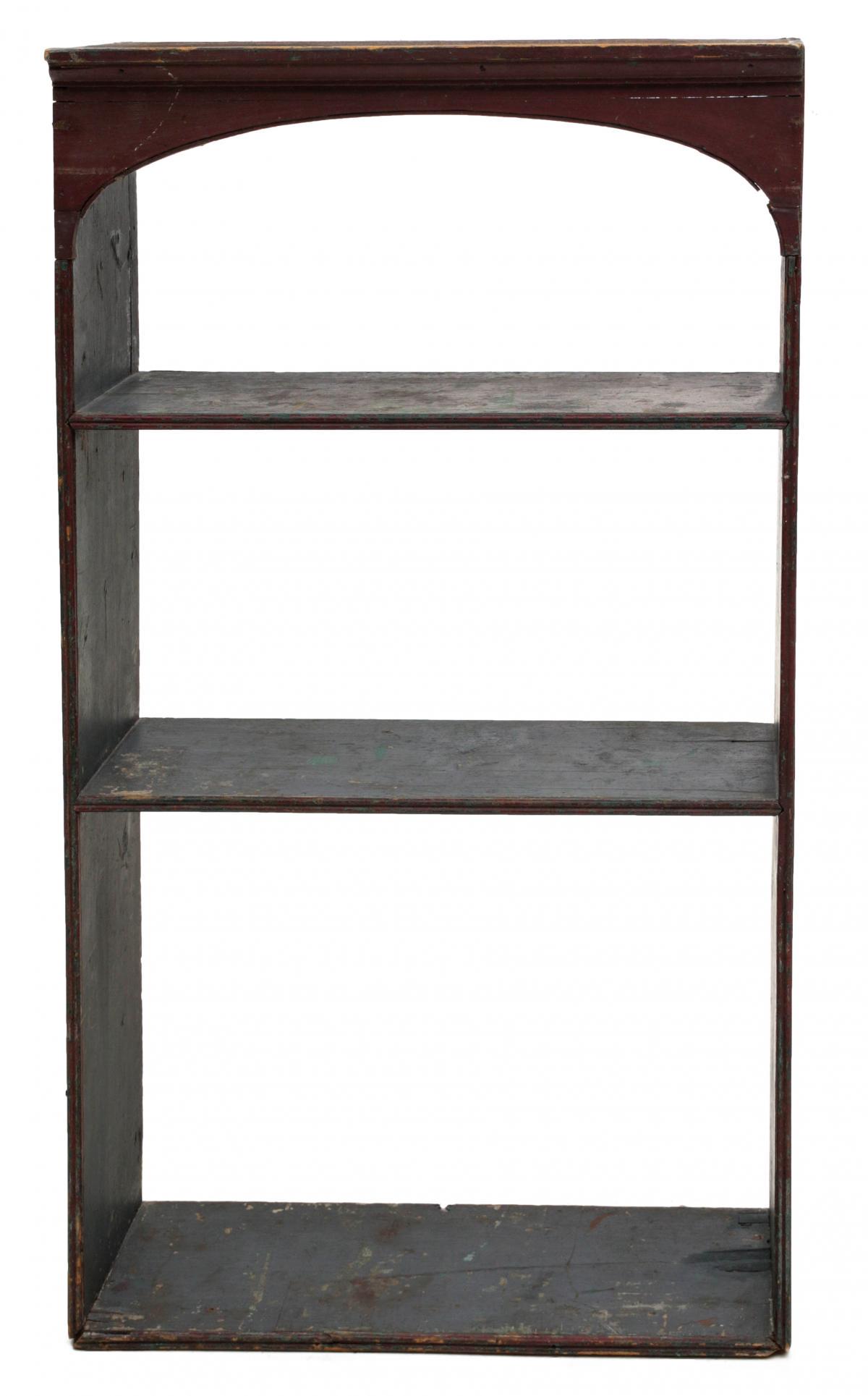 A 19TH CENTURY AMERICAN PAINTED SHELF WITH CORNICE: The vertical format hanging shelf framed with four boards and divided by two shelves in blue, red front cornice, all in original paint. Measures 43.75 x 8.25 x 25.25 inches. We happily provide seamles