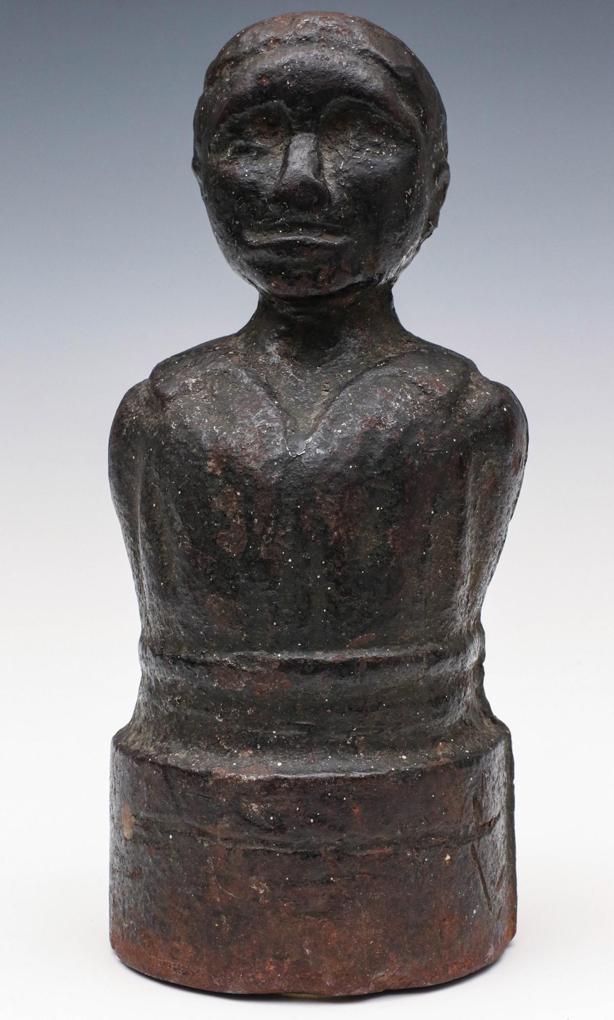 A FOLKY 19TH C. IRON AFRICAN AMERICAN MALE BUST FINIAL: The heavy 19th century American solid cast iron figure of an African American man wearing a shirt open at the neck with wide collar, primitive detailed features, integral cylindrical base, the whole c