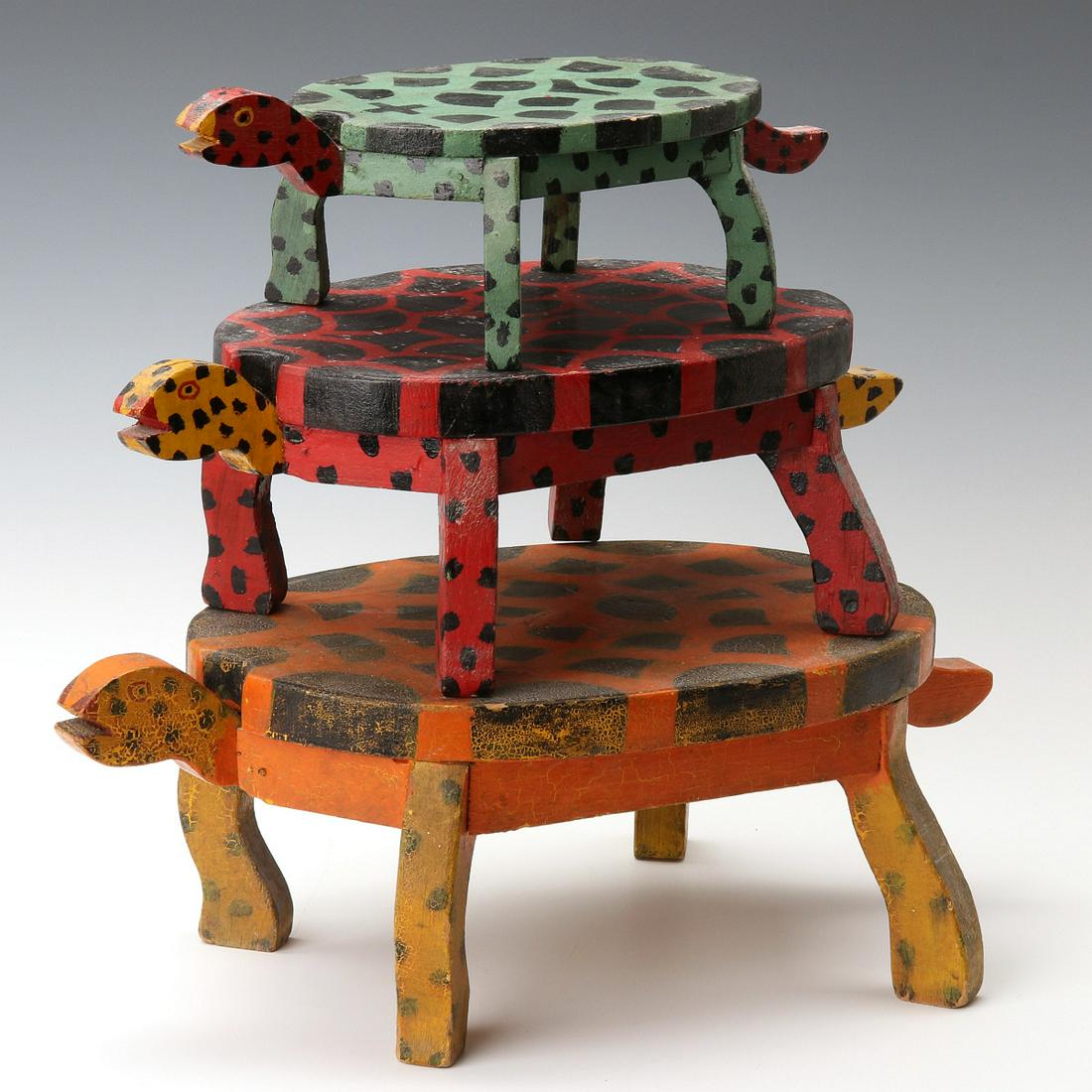 EARLY 20TH C. FOLK ART TURTLE FORM PAINTED WOOD STOOLS: The trio of colorfully painted wood folk art stools in graduated sizes, each oval top supported by four scroll cut legs on conforming frame with head and tail, original painted speckles, spots, eyes a