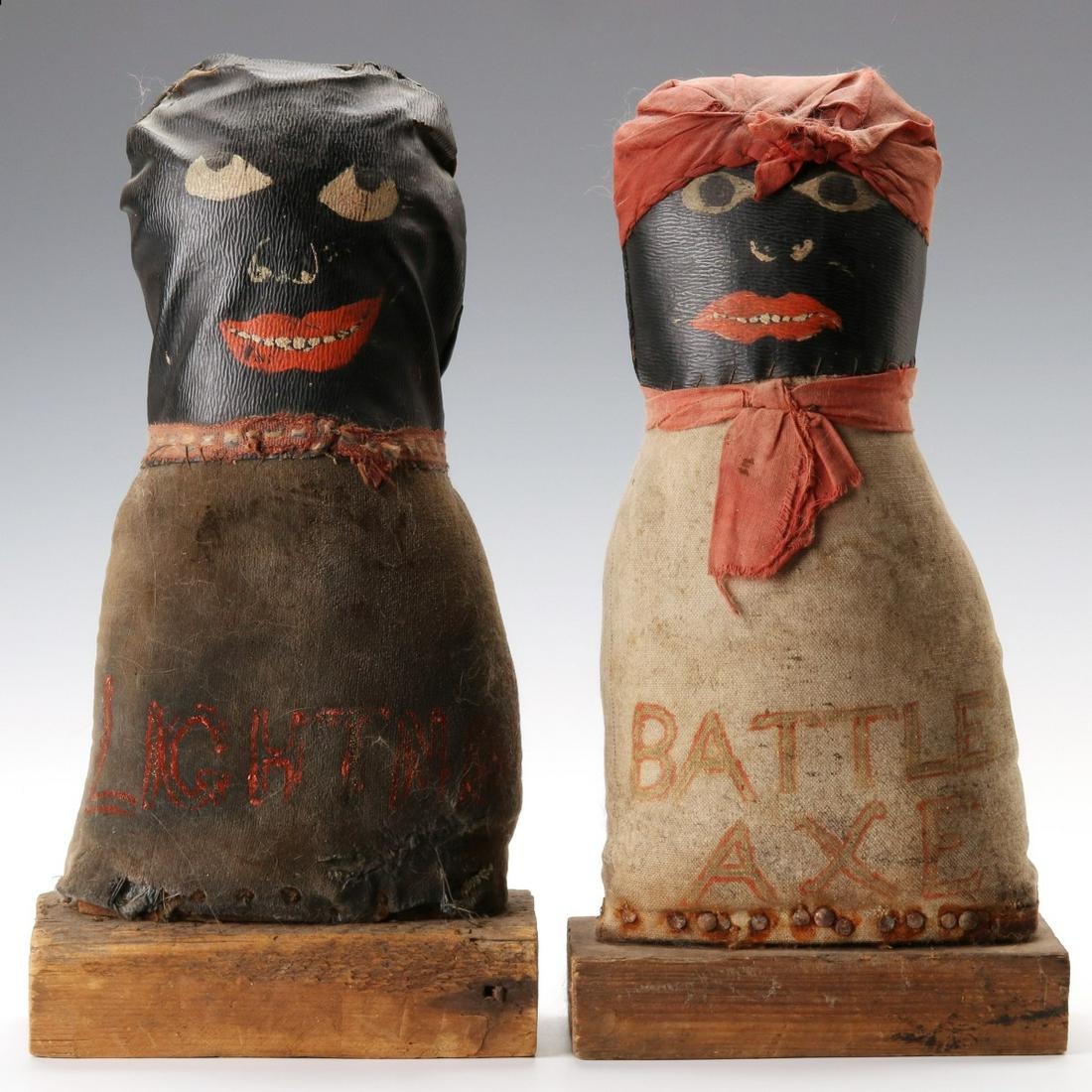 TWO FOLK ART PAINTED CLOTH CARNIVAL KNOCKDOWN TARGETS: The pair of ball toss knockdown figures made from coated fabric with painted details over unglazed cotton cloth with painted lettering of 'Lightning' and 'Battle Axe', each has red cloth at the neck,