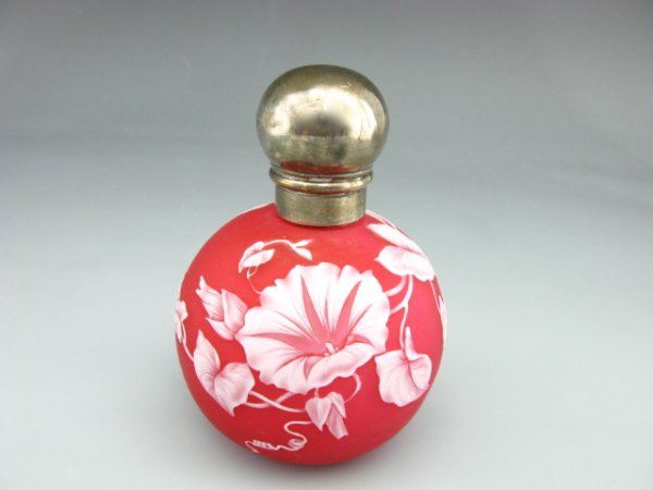 AN 1887 THOMAS WEBB & SONS CAMEO GLASS SCENT BOTTL: Morning Glory flowers in white cut back to a satin finish cranberry, hallmarked sterling silver threaded cover with hallmarks for London, 1887, sterling, maker's mark of S.M, perhaps Samuel Mordan. Me
