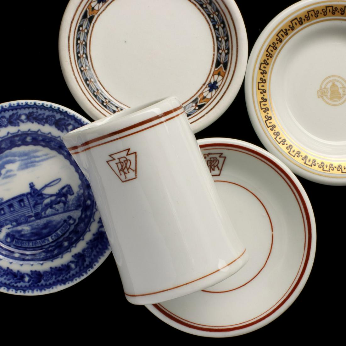 A COLLECTION OF RAILROAD CHINA BUTTER PATS AND CREAMER (1 of 10)