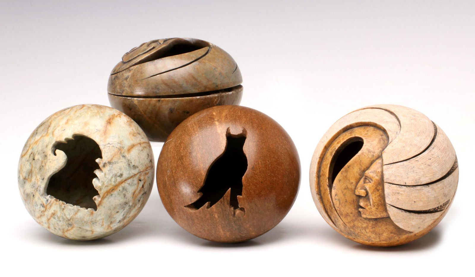 A COLLECTION OF CARVED BONE AND STONE SMUDGE POTS: Late 20th Century. Includes: A carved bone smudge pot with a figural owl cut out signed Art Brown; A Joe Greene (born 1983, Six Nations - Iroquois) carved smudge pot signed on the base and dated 2003;