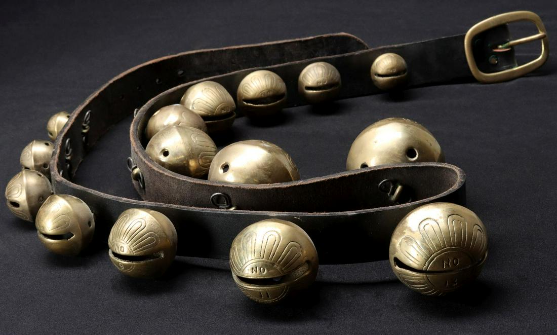 A STRAP OF REPRODUCTION GRADUATED BRASS SLEIGH BELLS (1 of 3)