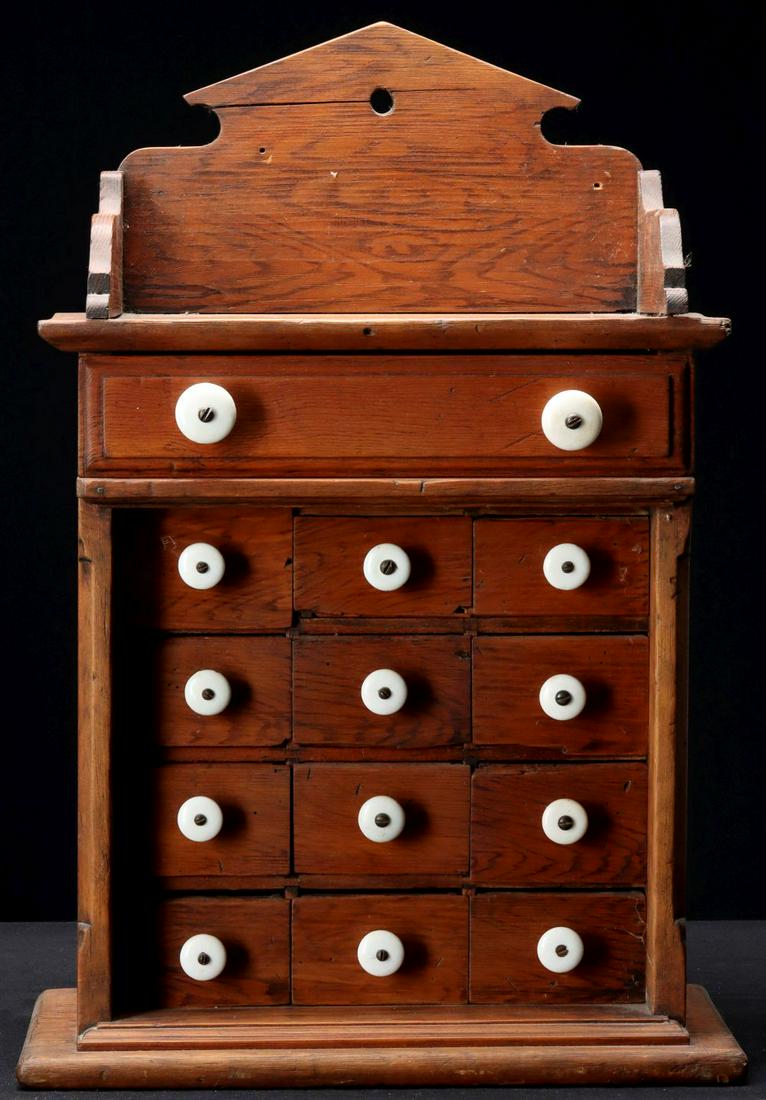 A PINE THIRTEEN DRAWER SPICE CABINET CIRCA 1890 (1 of 3)